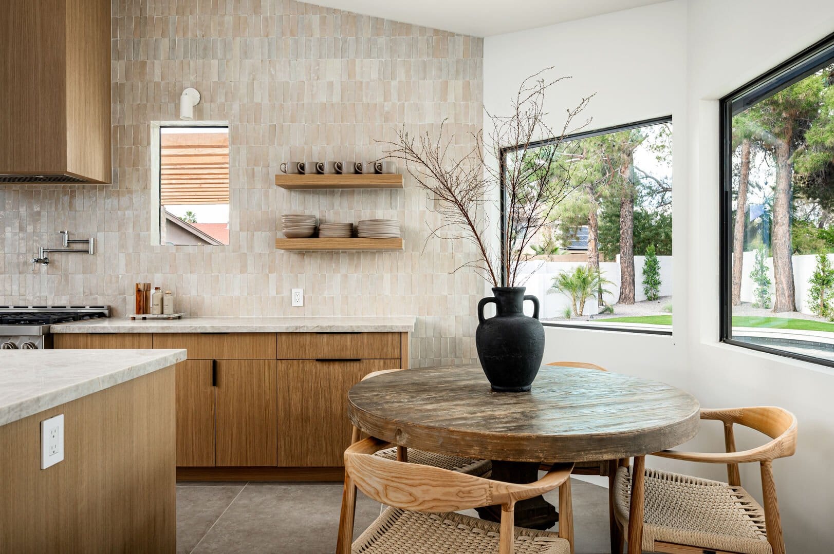 Modern kitchen with rustic dining table.