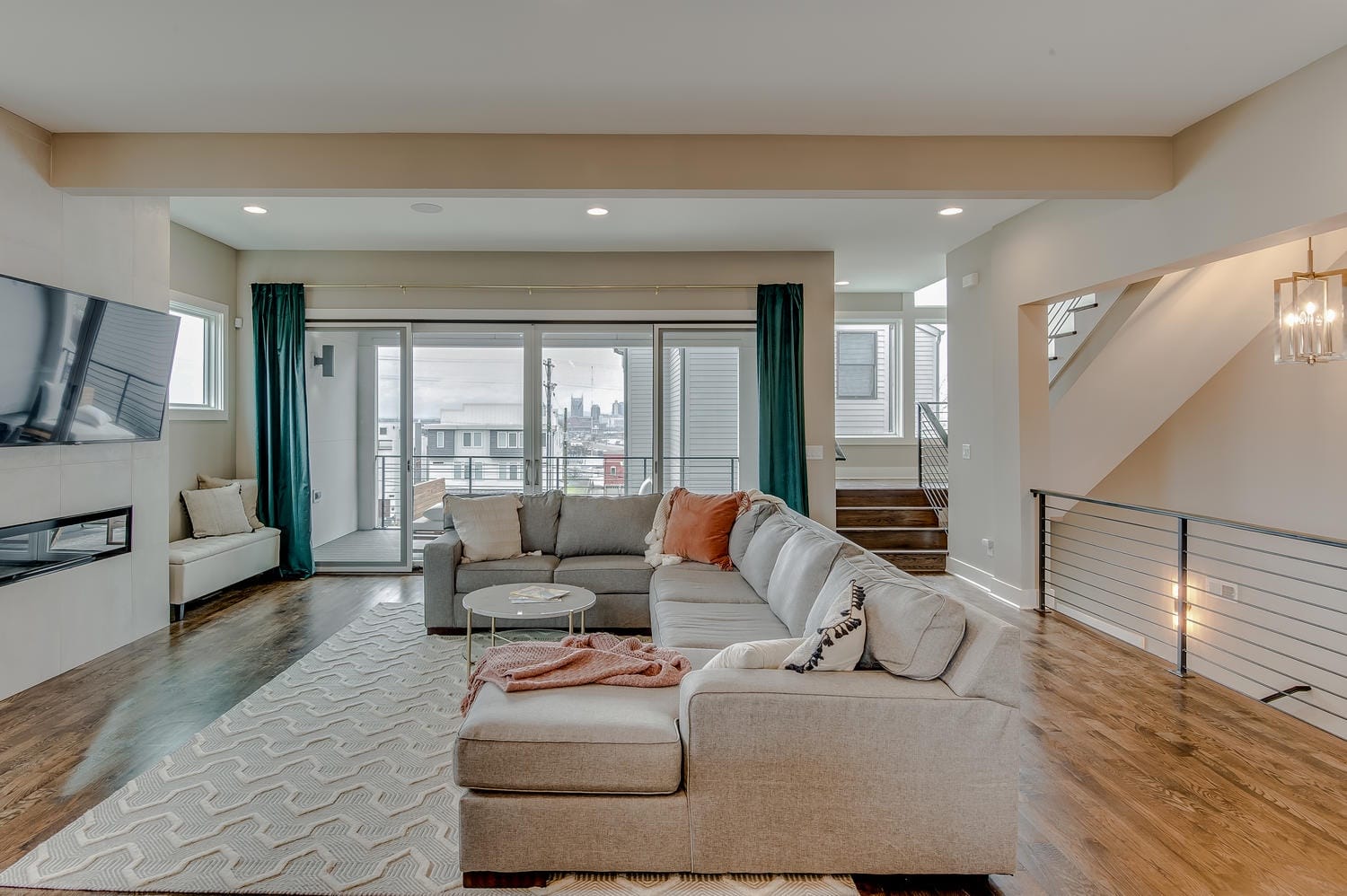 Modern living room with large windows.