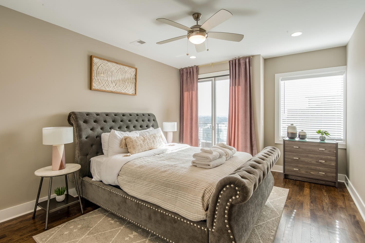 Modern bedroom with upholstered bed.