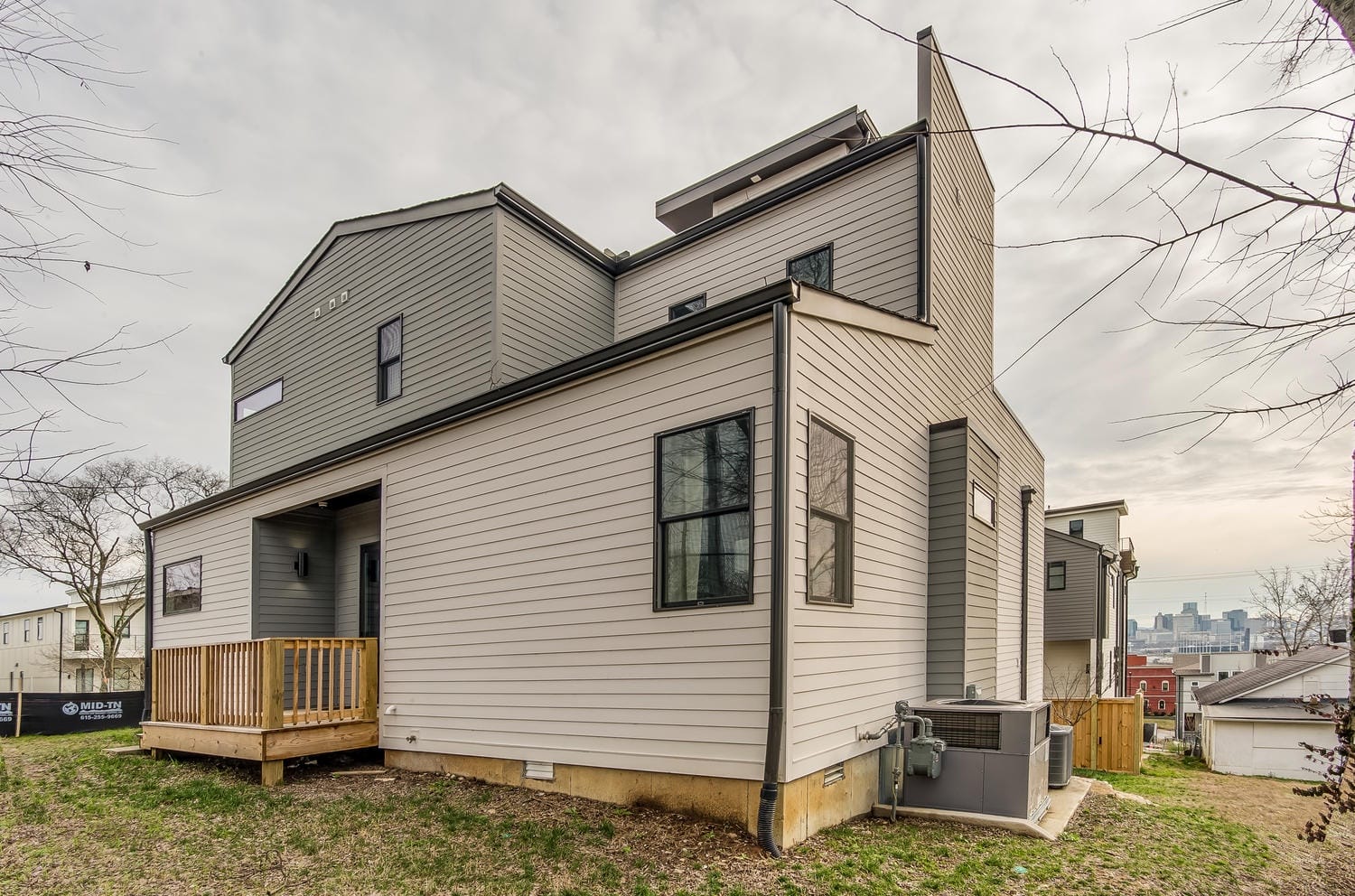 Modern two-story grey house exterior.