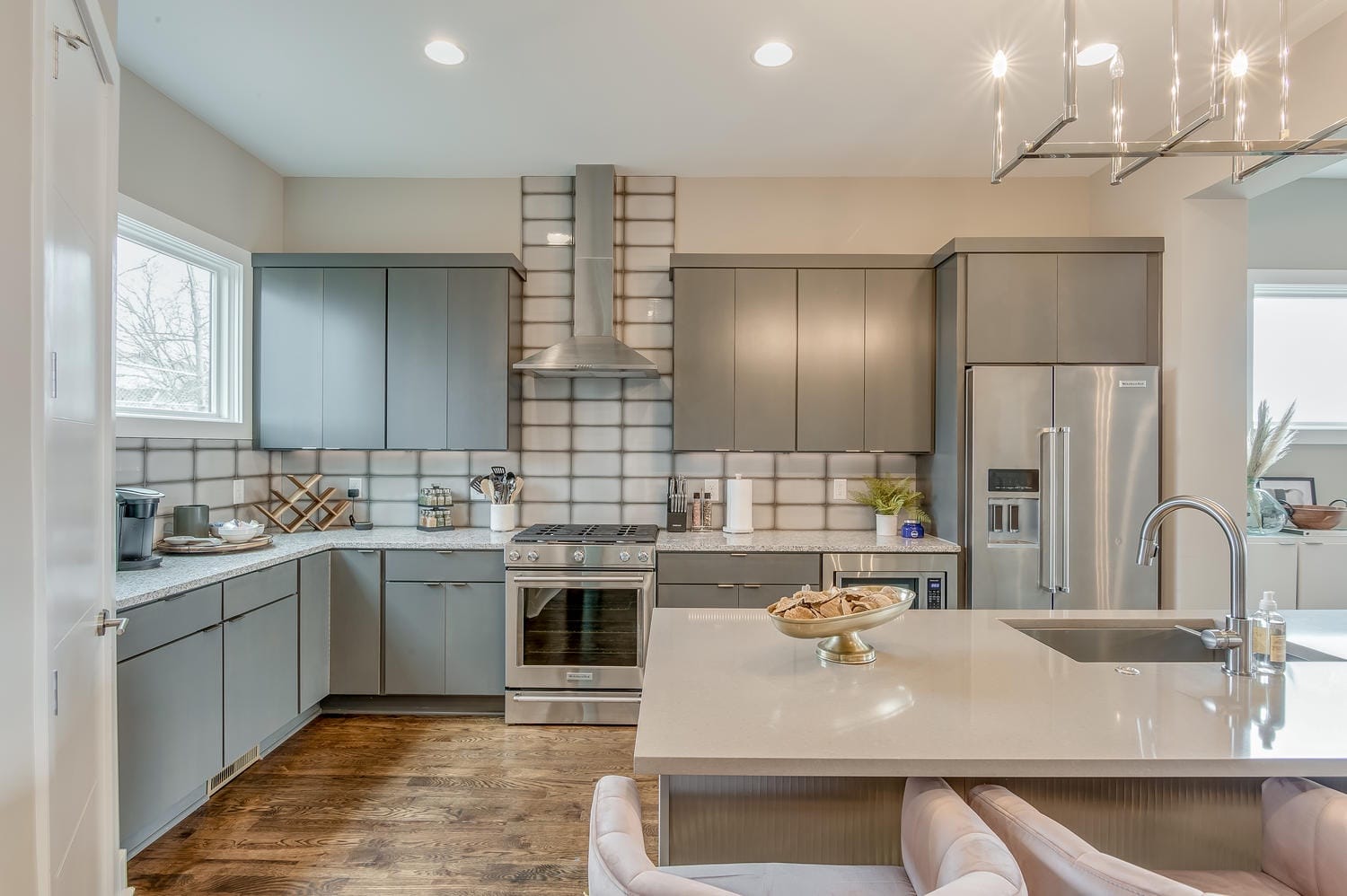 Modern kitchen with grey cabinets.