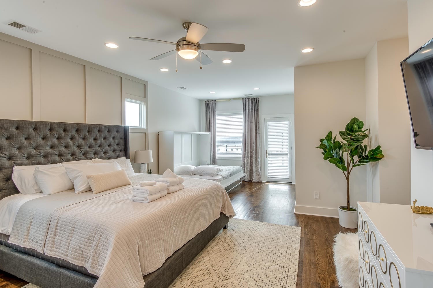 Spacious bedroom with modern decor.