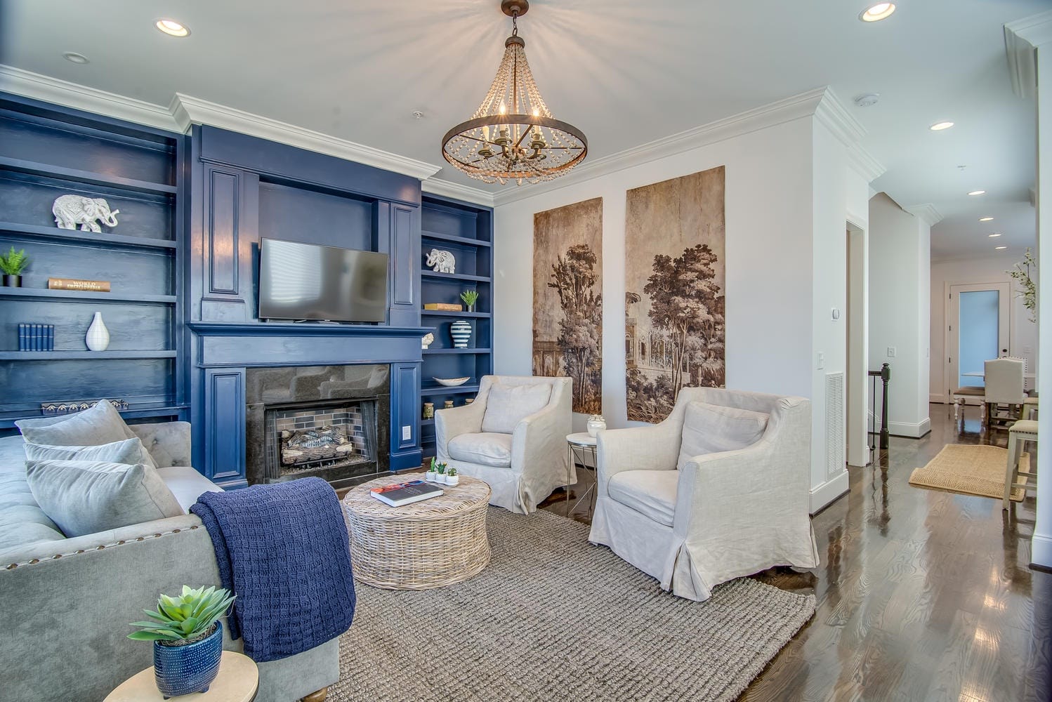 Modern living room with blue accents.