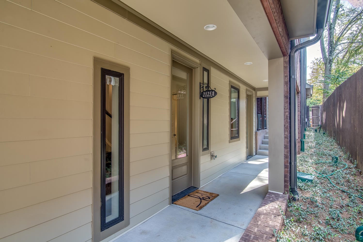 Apartment entryway and narrow walkway.