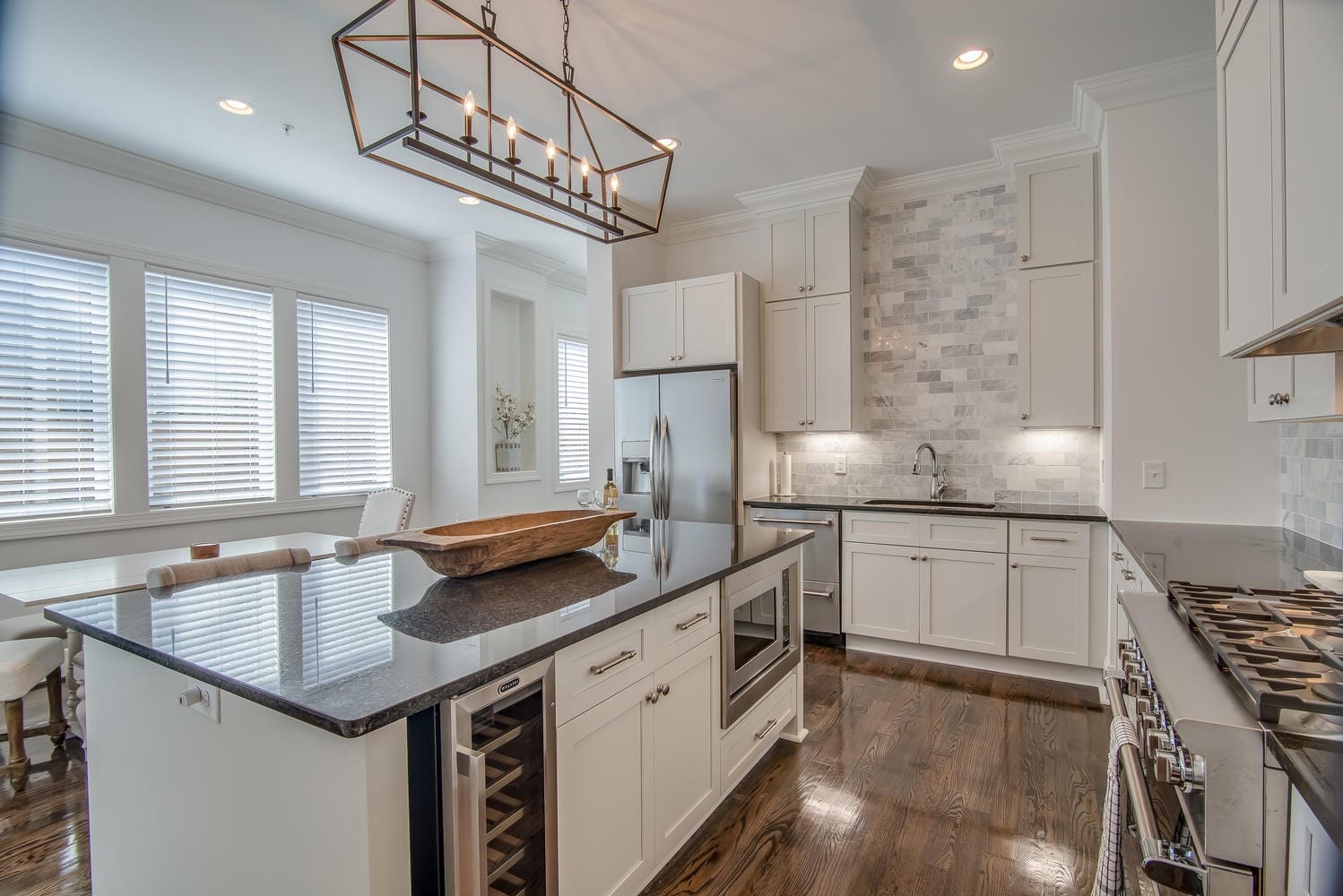 Modern kitchen with island and appliances.