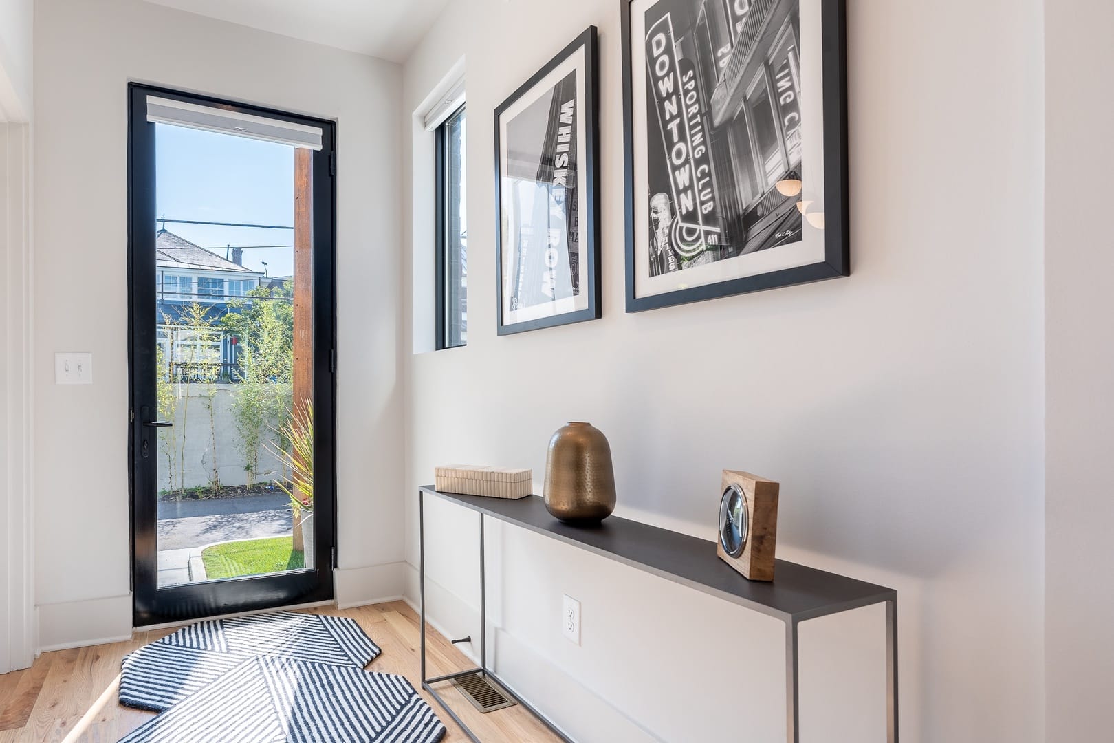 Modern entryway with decorative console.