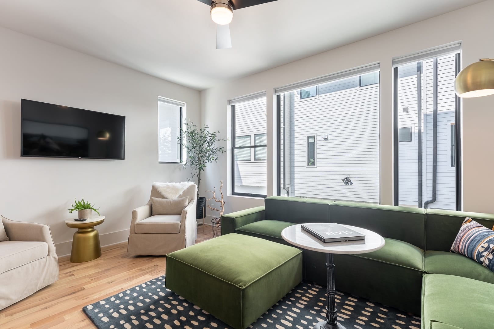 Modern living room with large windows.