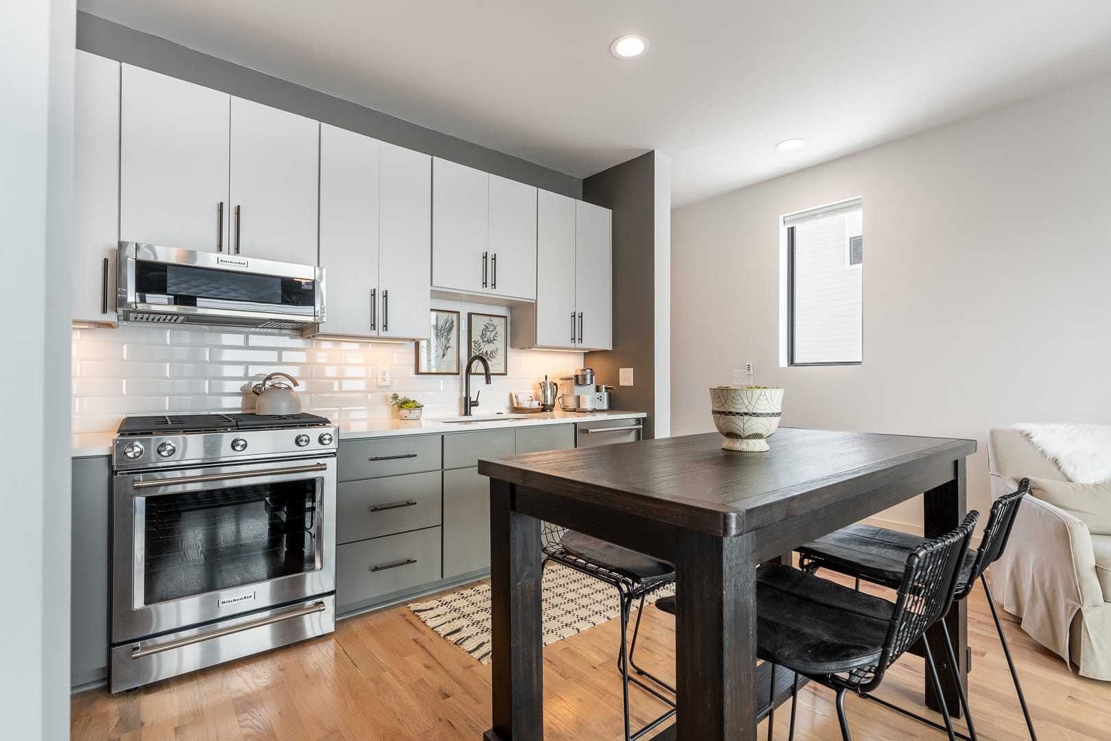 Modern kitchen with dining table.