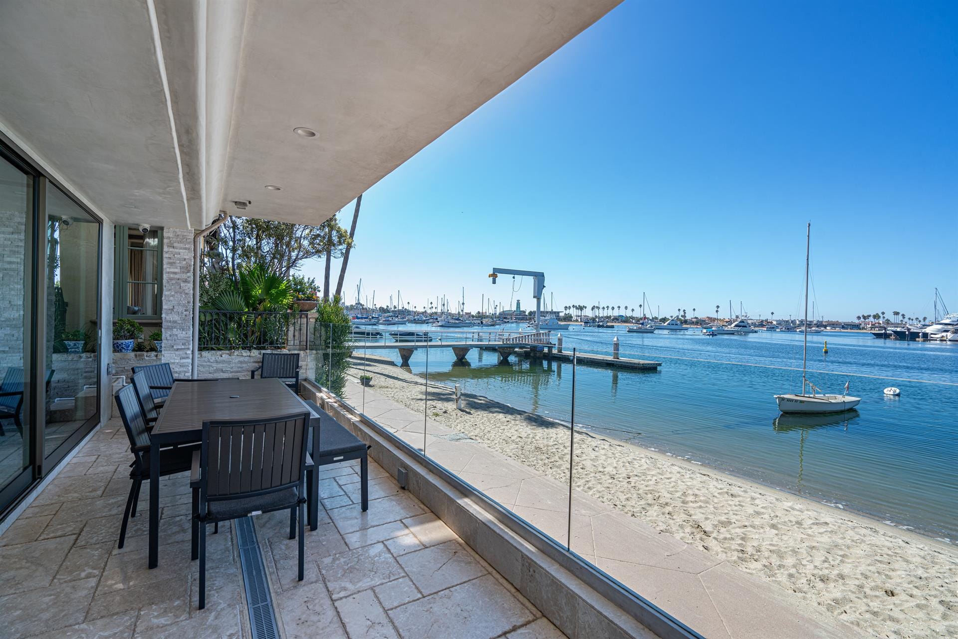 Patio overlooking marina and beach.