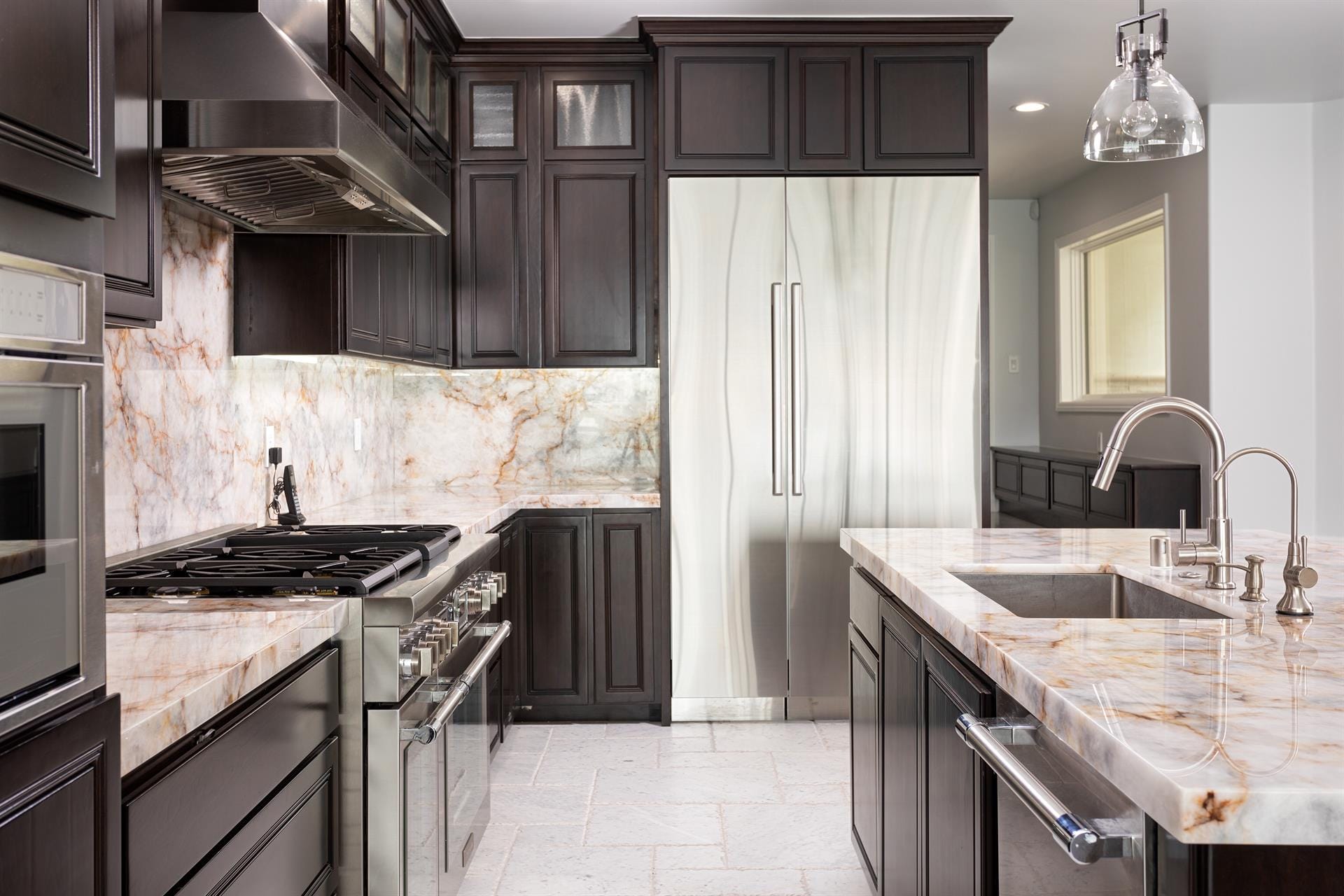 Modern kitchen with stainless steel appliances.