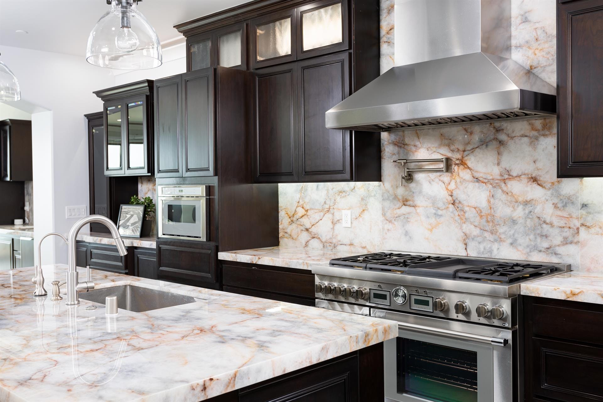 Modern kitchen with marble countertops.