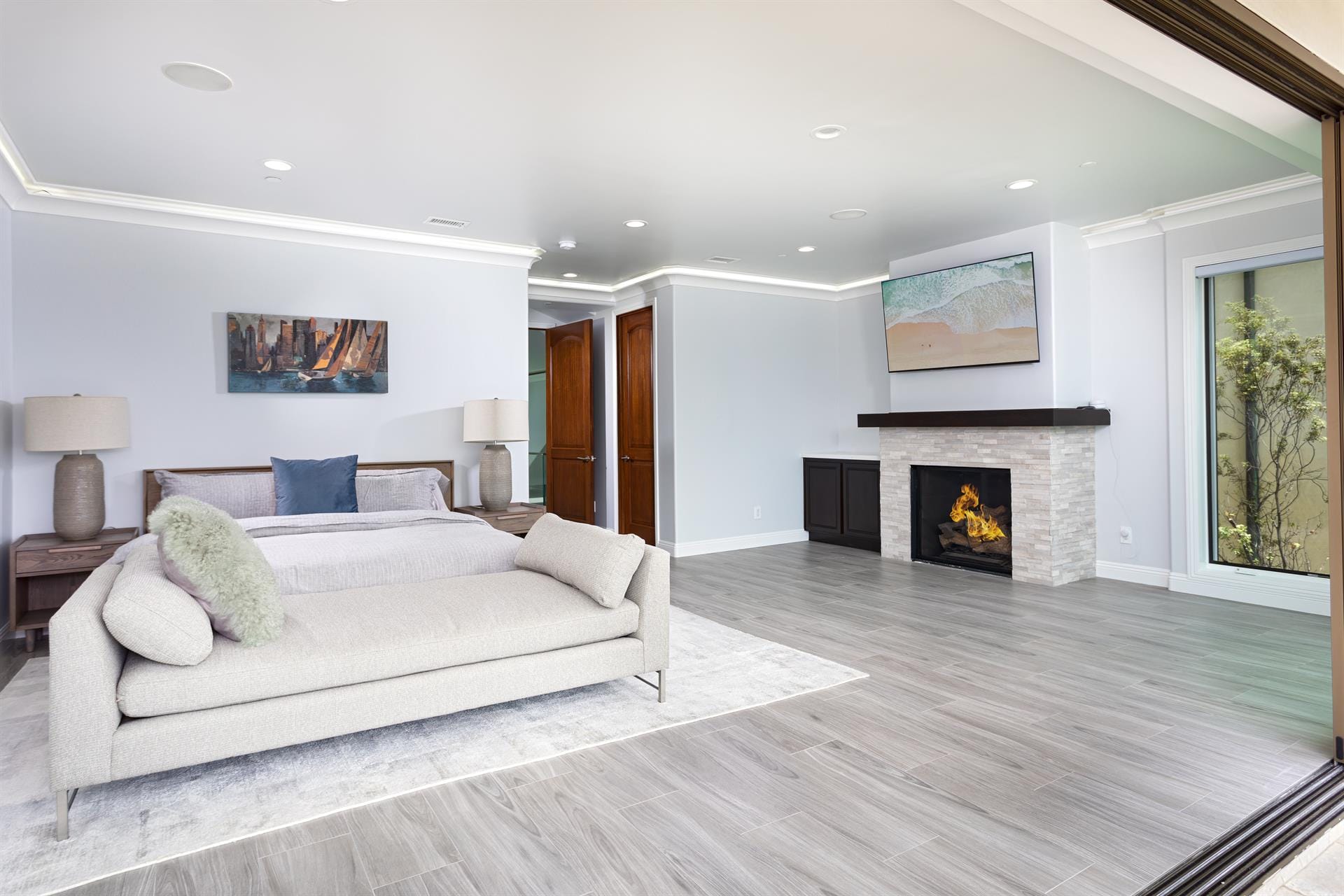 Modern bedroom with fireplace view.