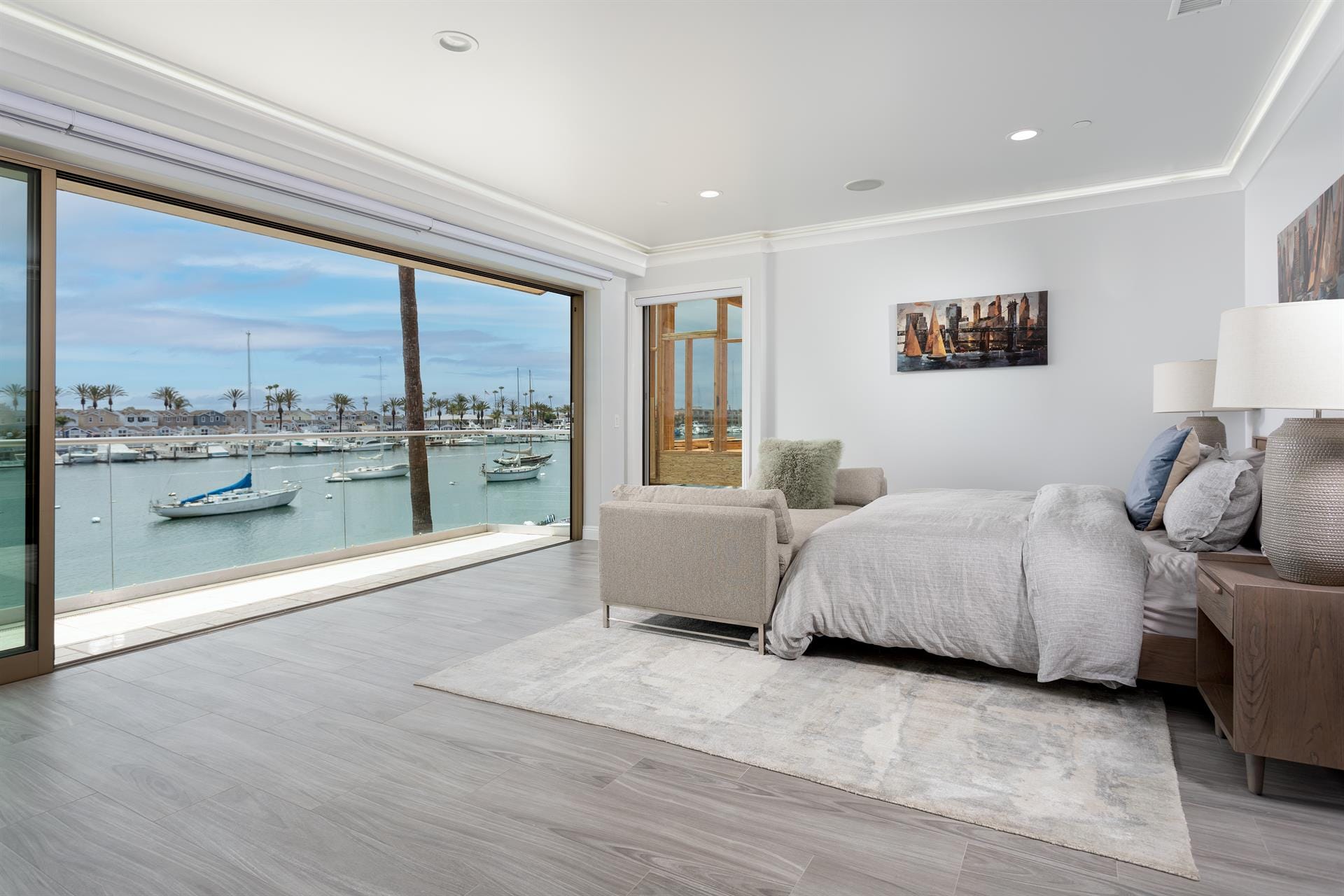 Bedroom with large waterfront view.