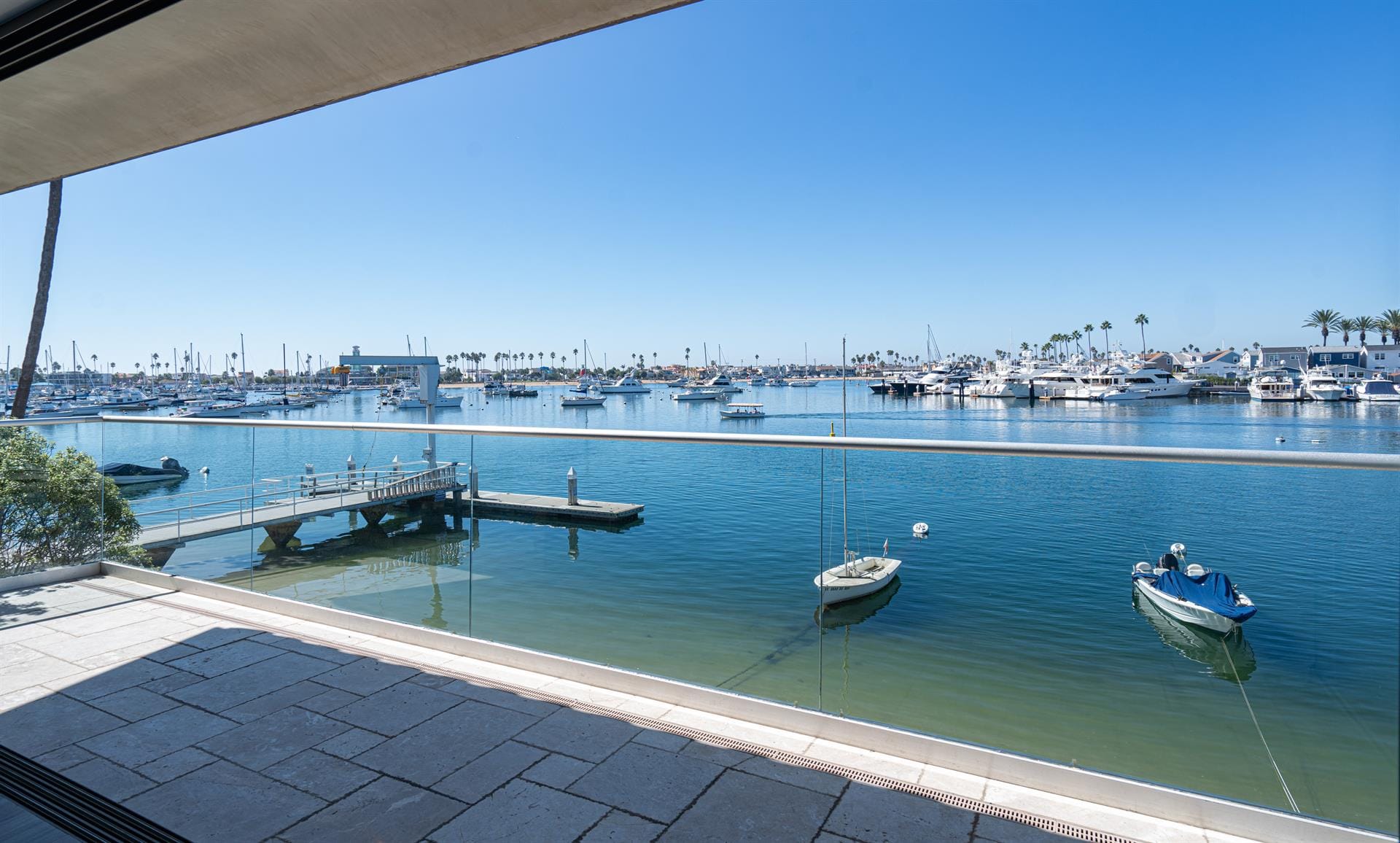 Dock with boats in peaceful harbor.