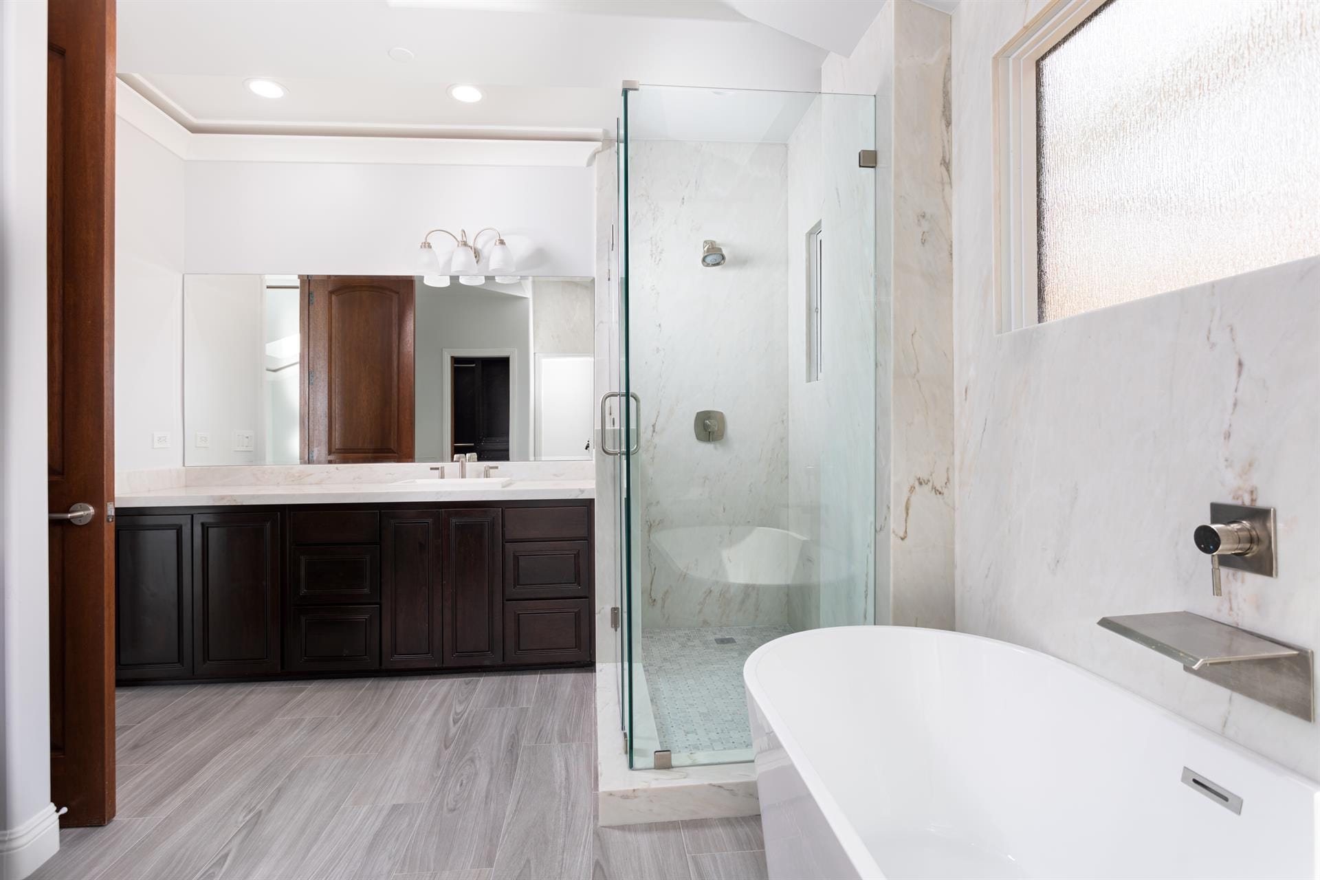 Modern bathroom with tub and shower.