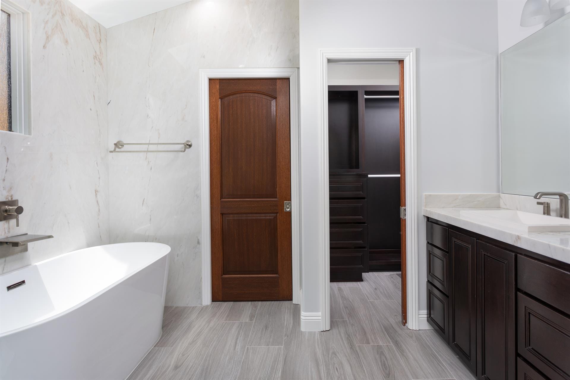 Modern bathroom and closet entrance.