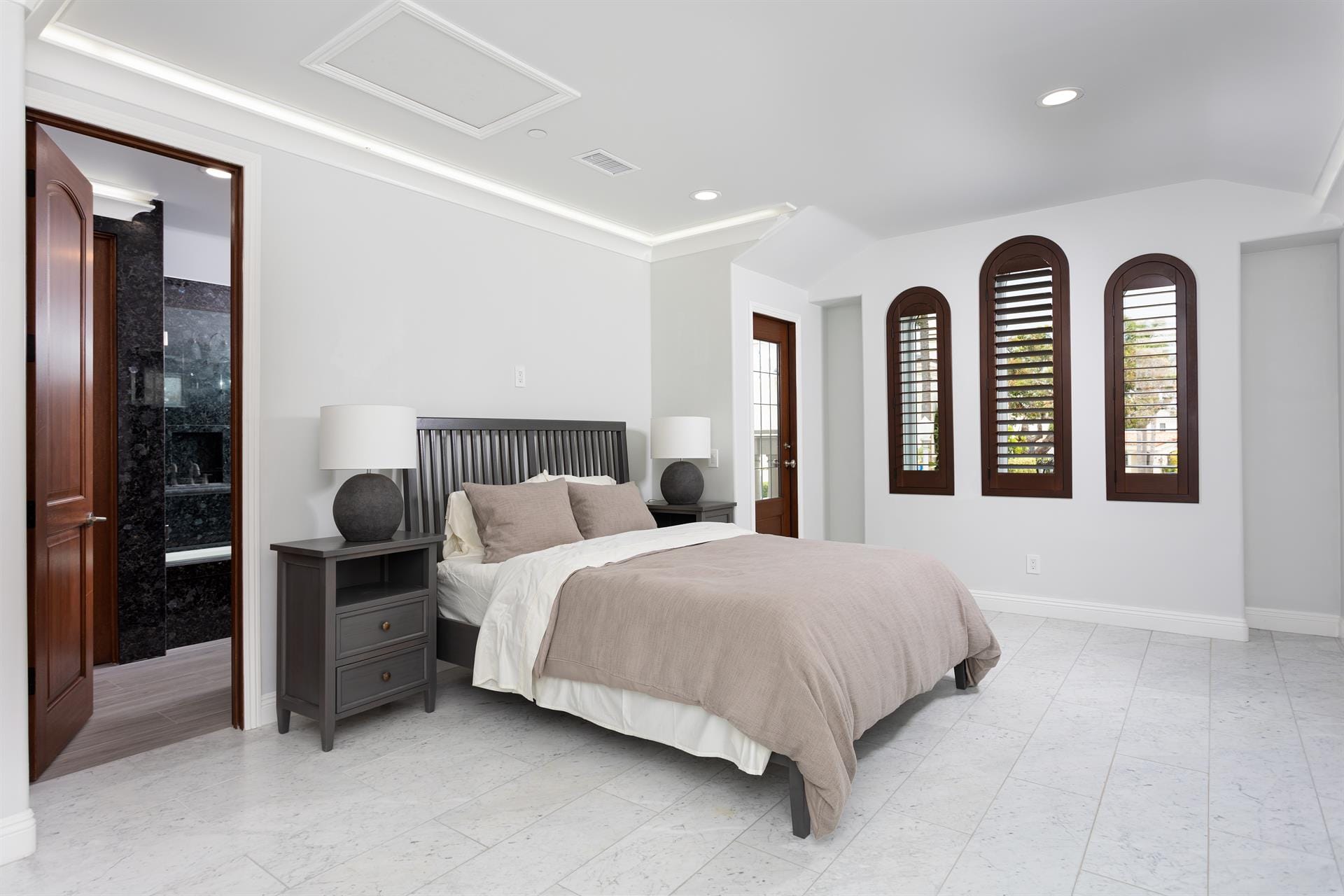 Modern bedroom with large windows.