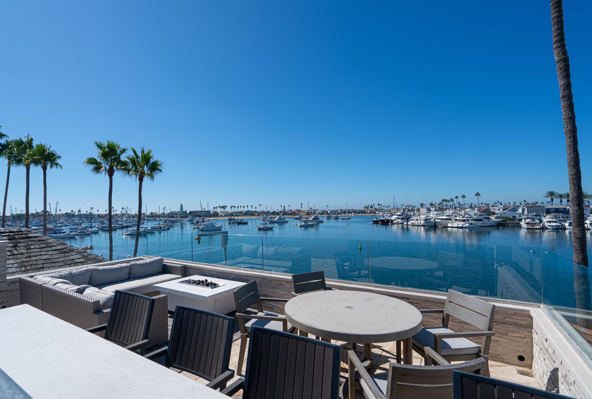 Waterfront patio with marina view.