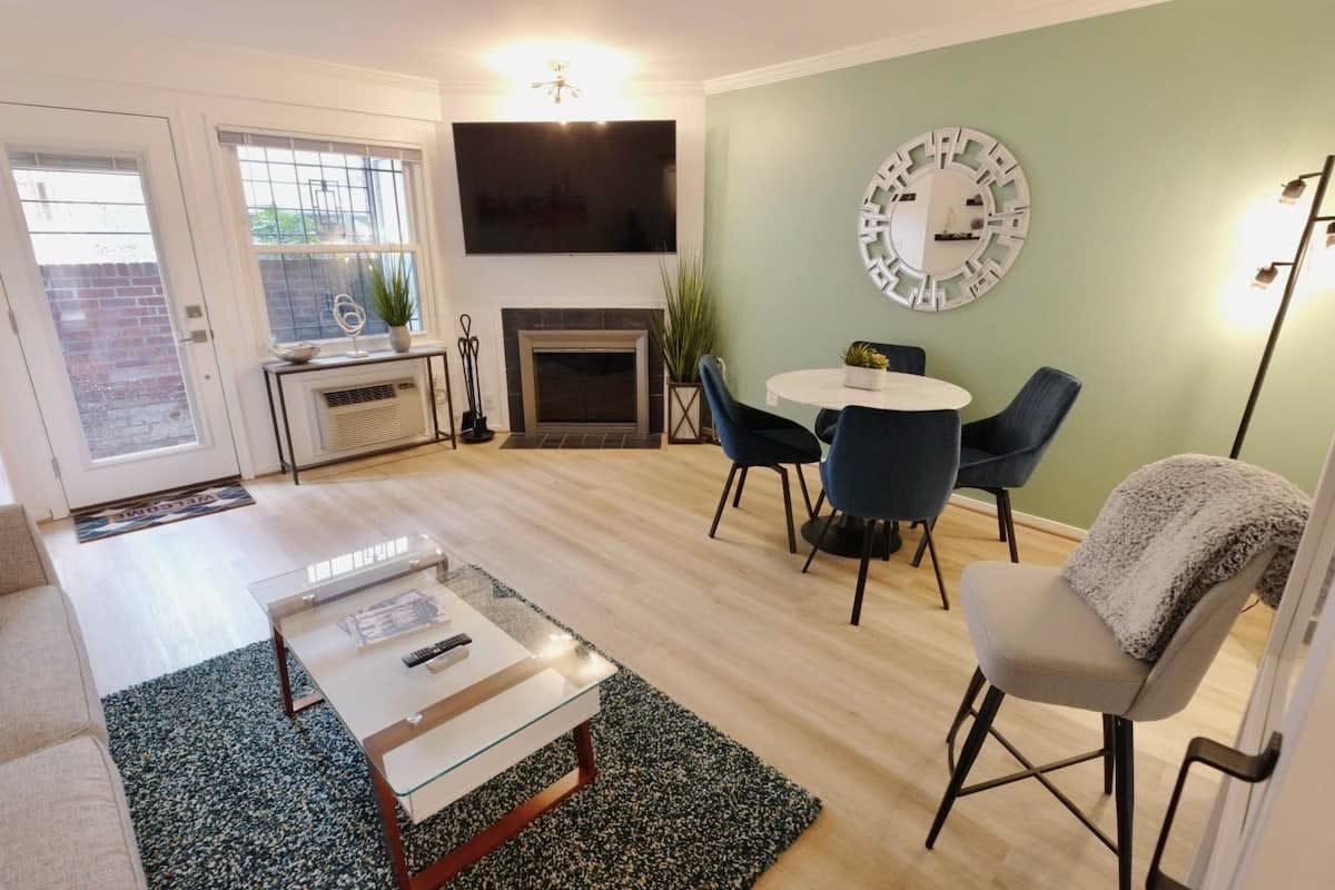 Modern living room with dining area.