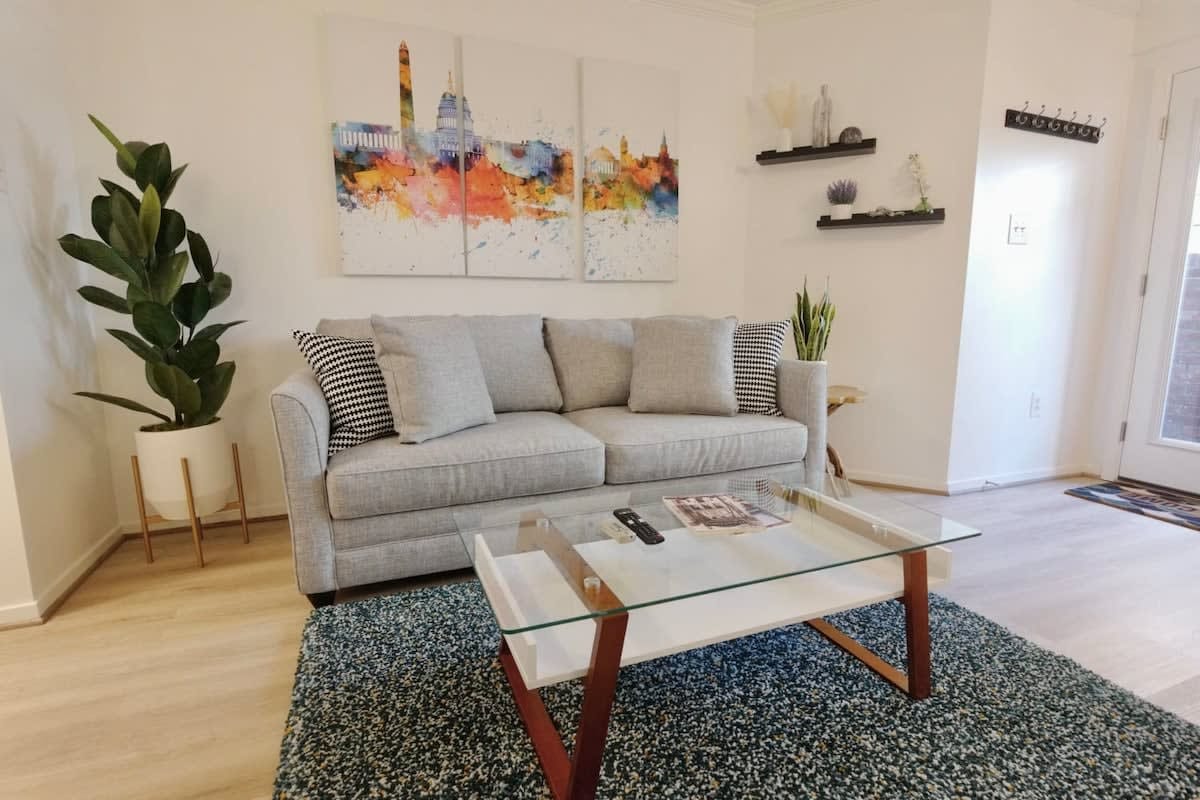 Modern living room with gray sofa.