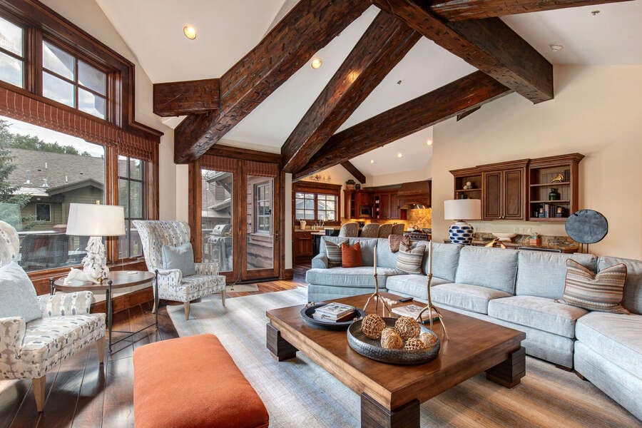 Spacious living room with wooden beams.