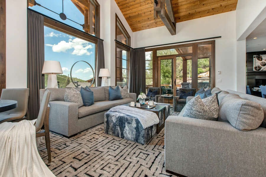 Modern living room with large windows.