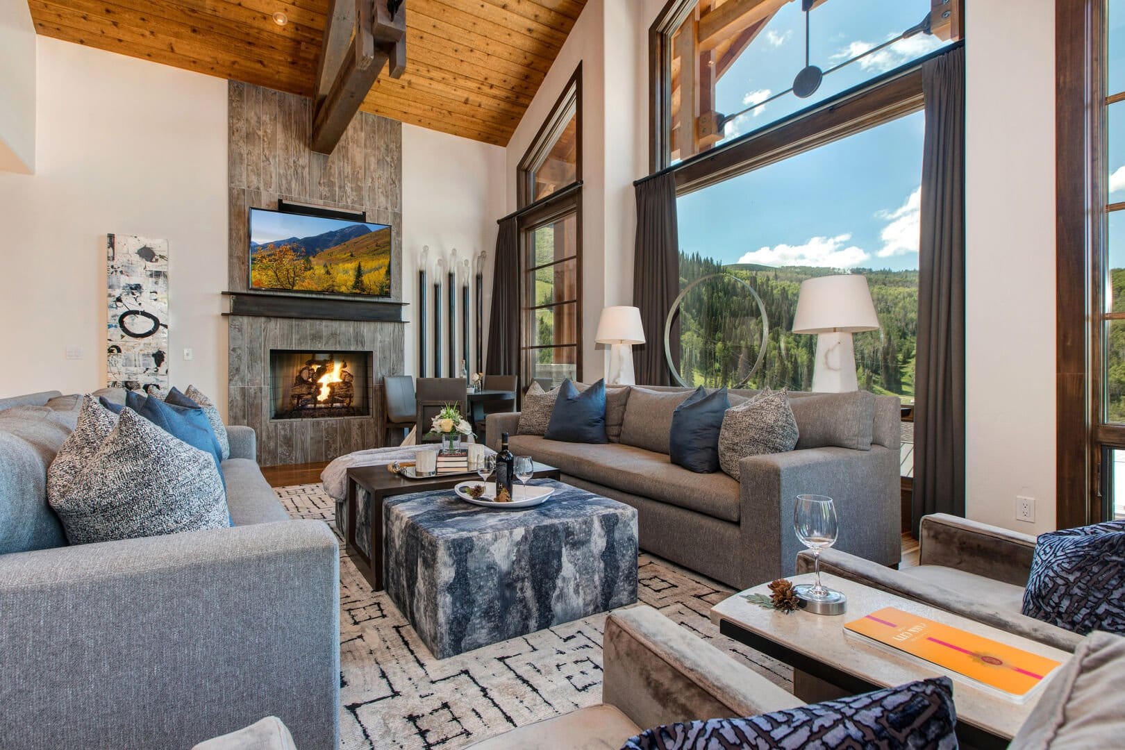 Modern living room with large windows.