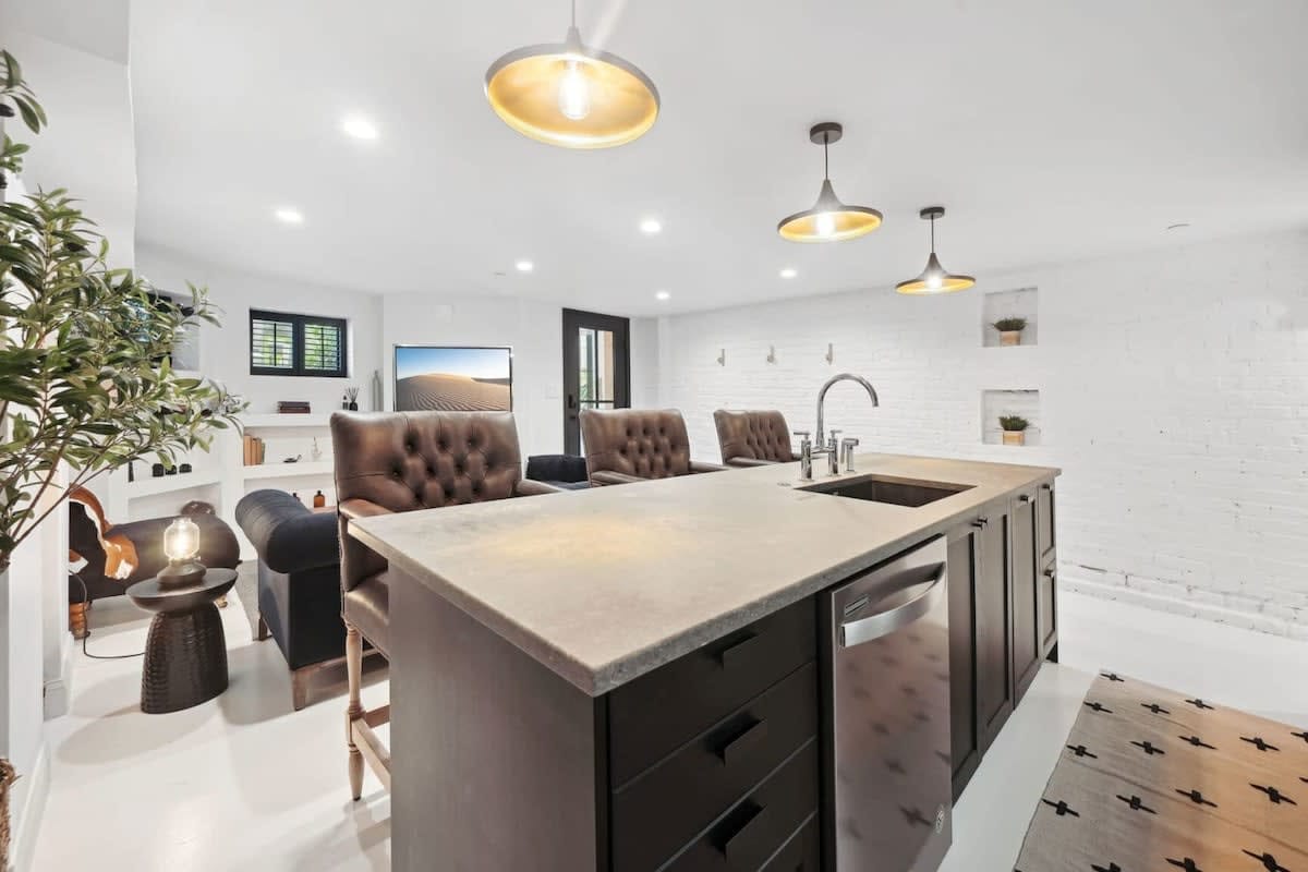 Modern kitchen with island and seating.