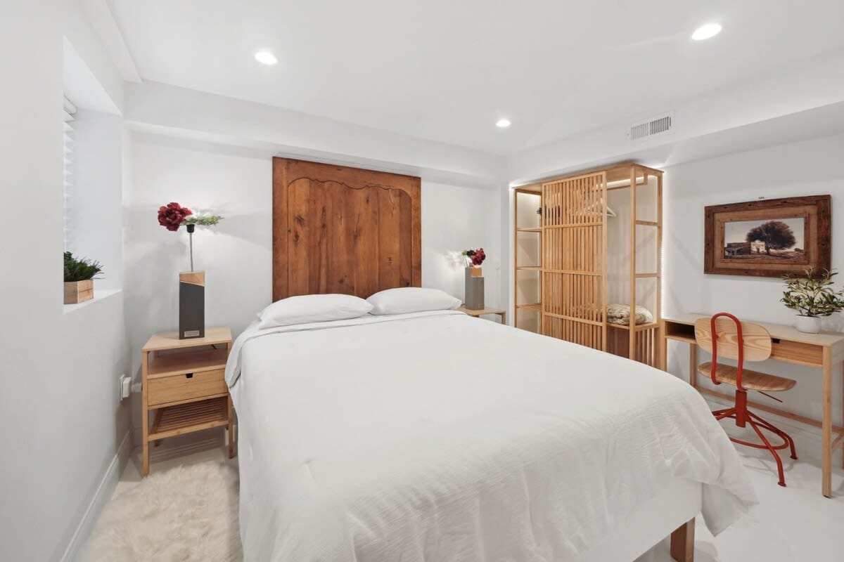 Minimalist bedroom with wood accents.