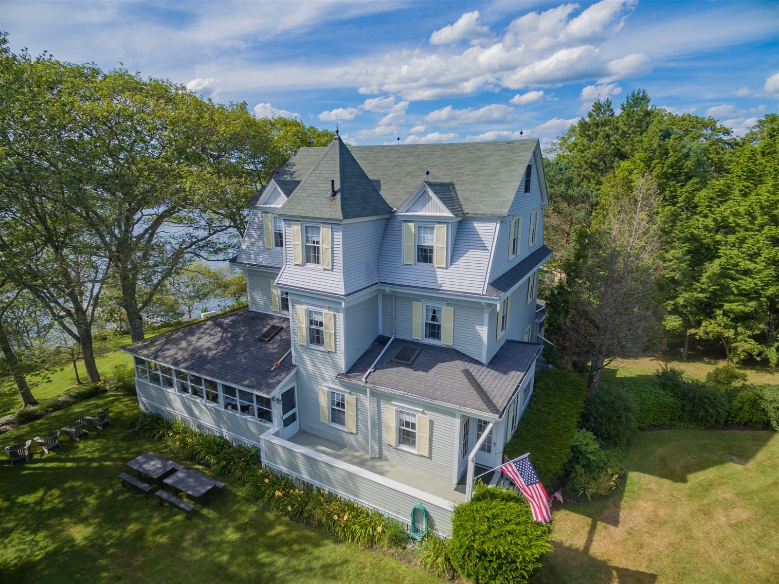 Large house with American flag.