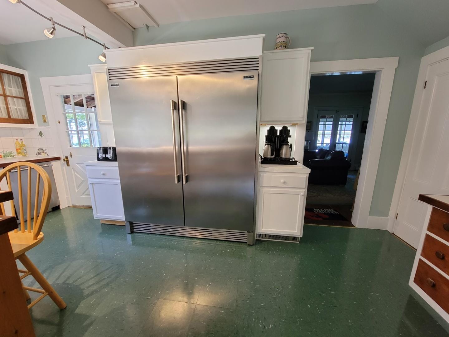 Spacious kitchen with double refrigerator.