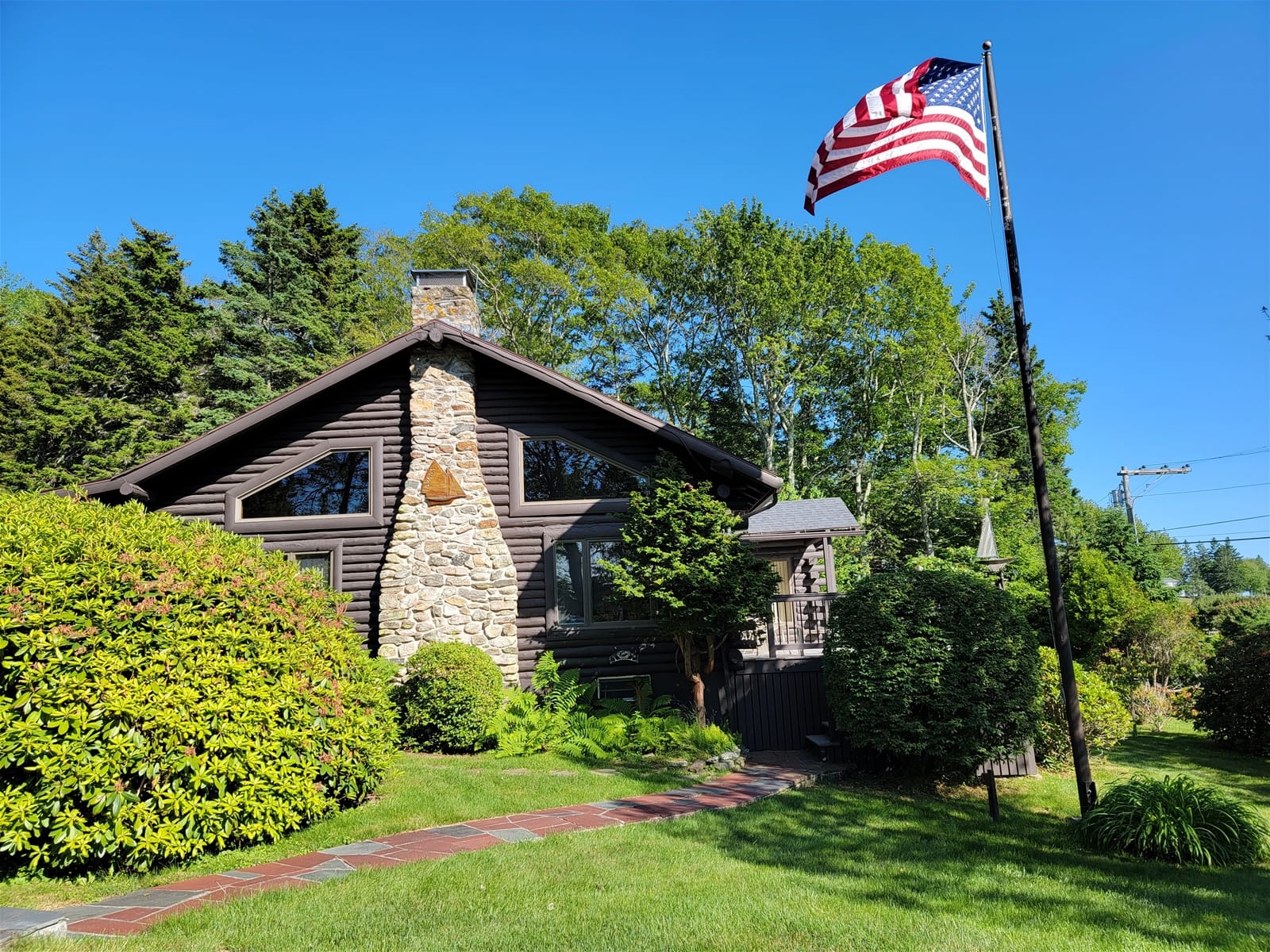 Log cabin with American flag.