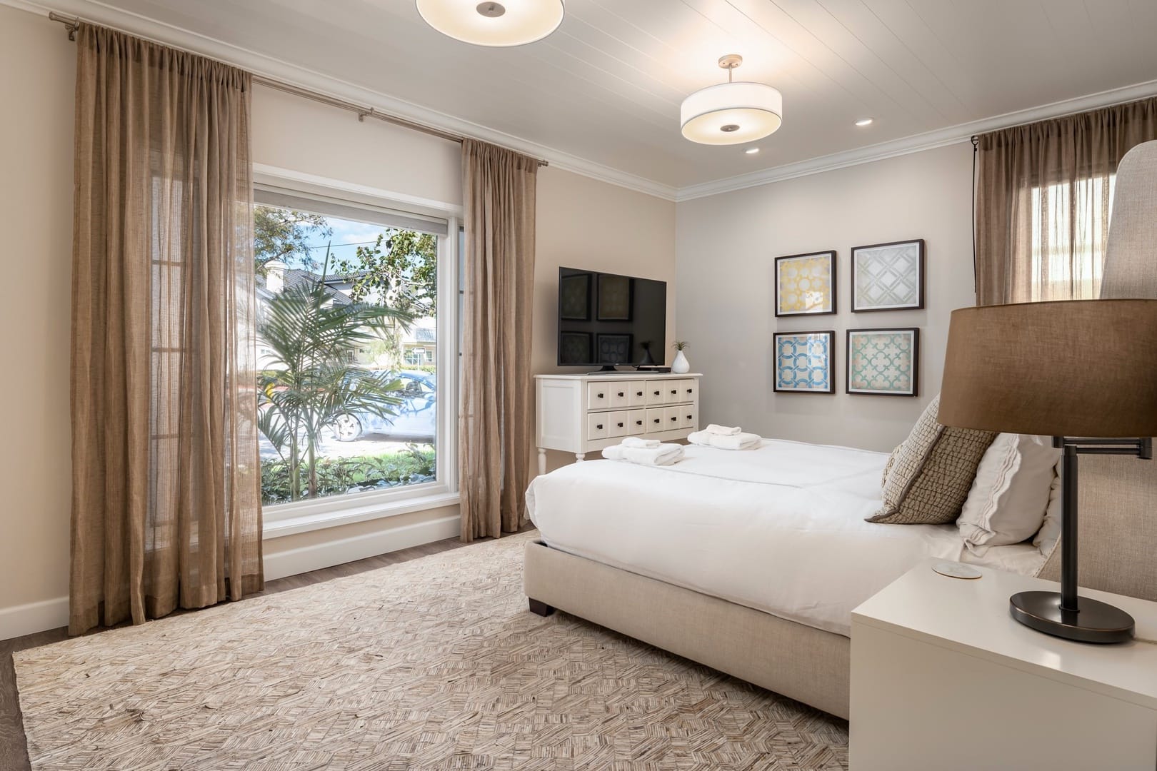 Bright bedroom with large window.