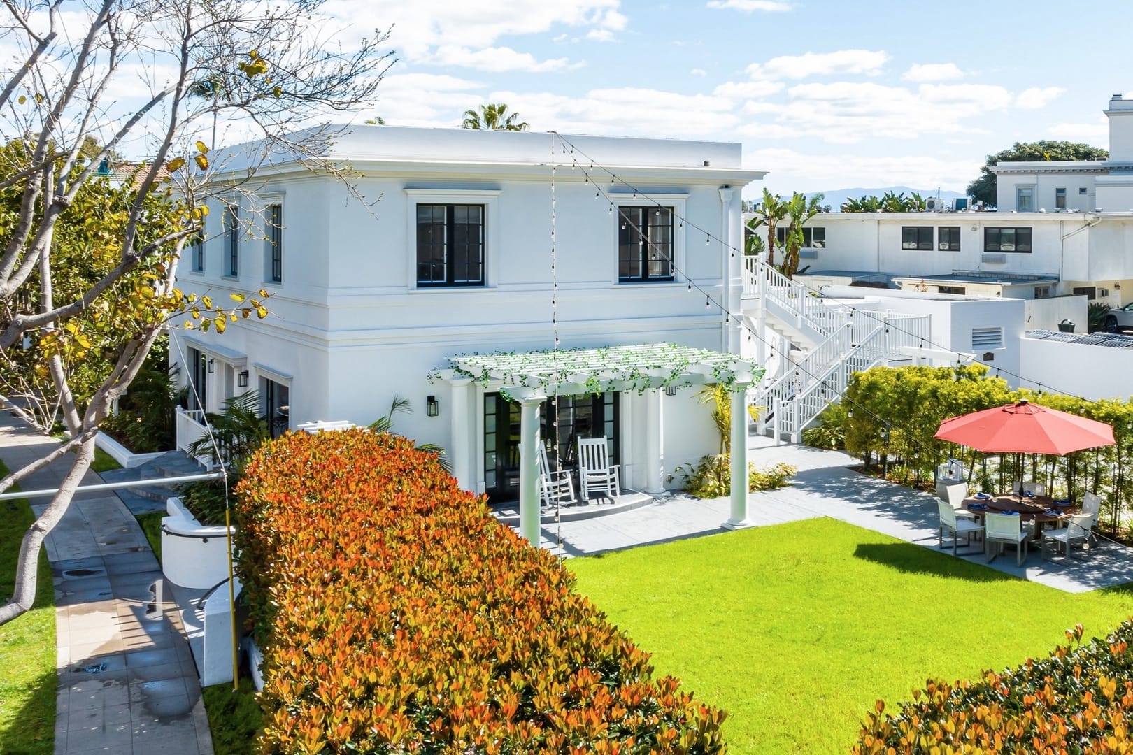 Two-story house with backyard patio.