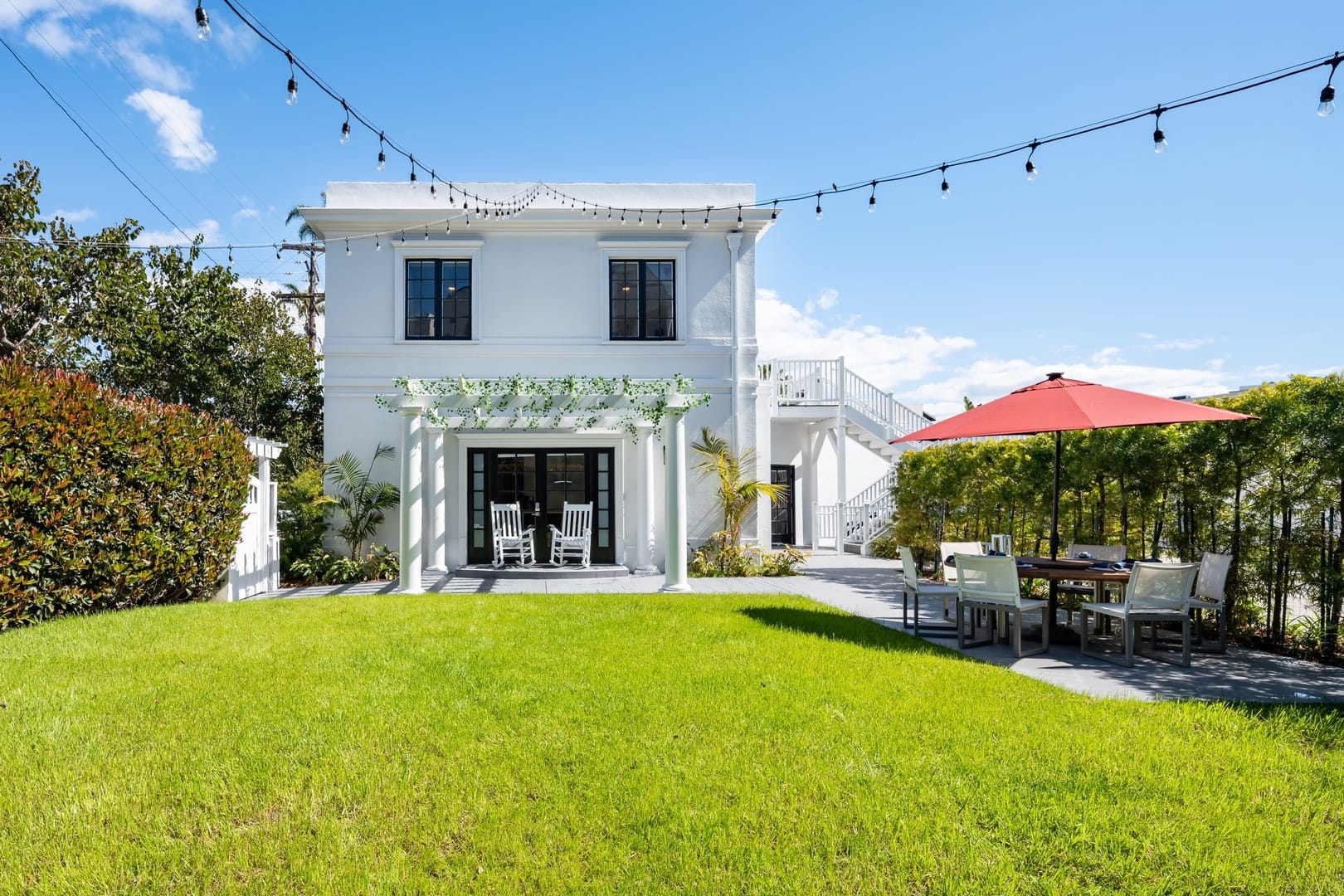 Two-story house, backyard with patio.