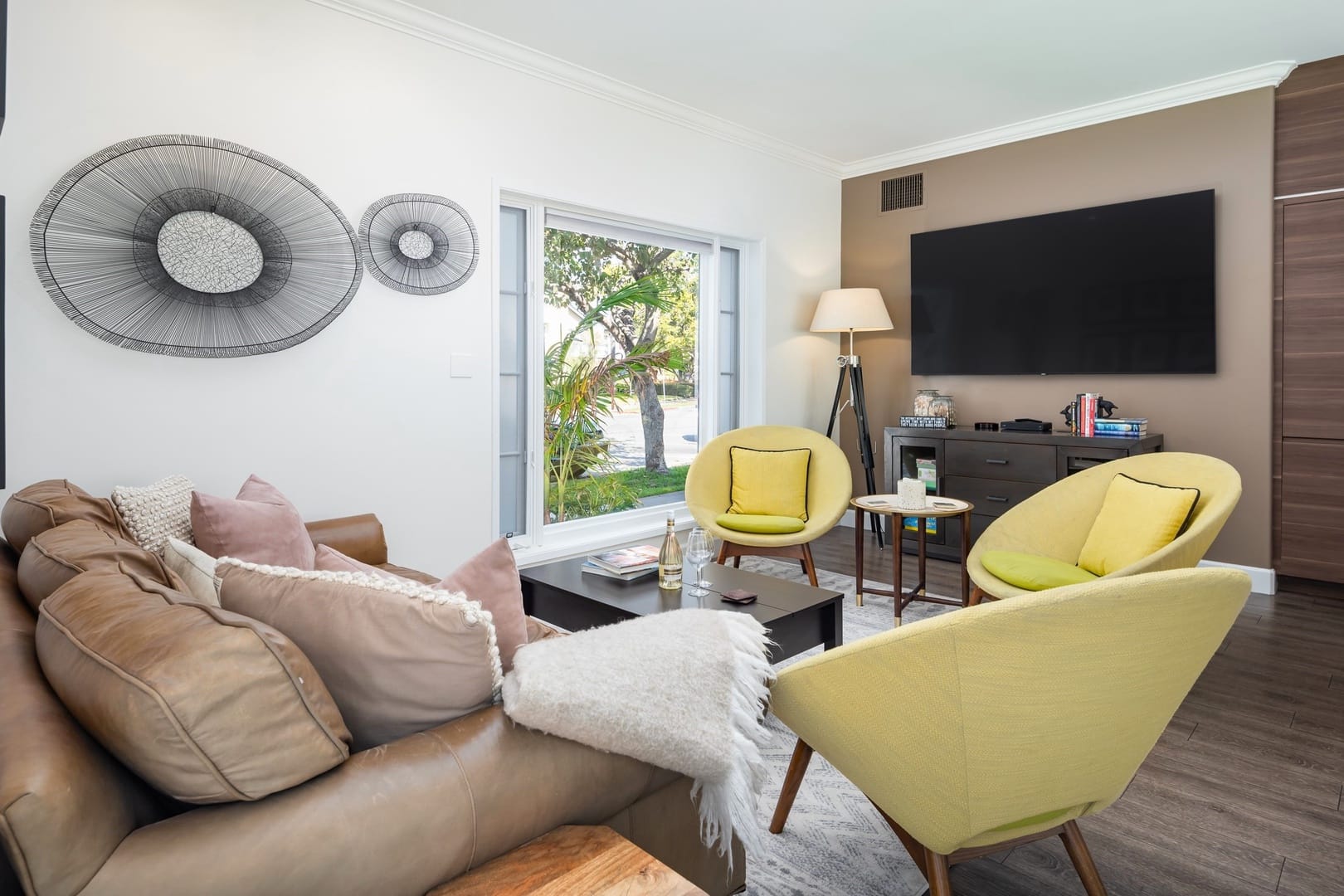 Modern living room with yellow chairs.