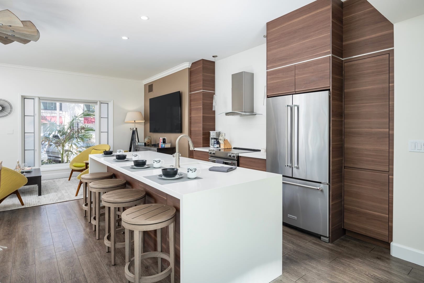 Modern kitchen with a living area.