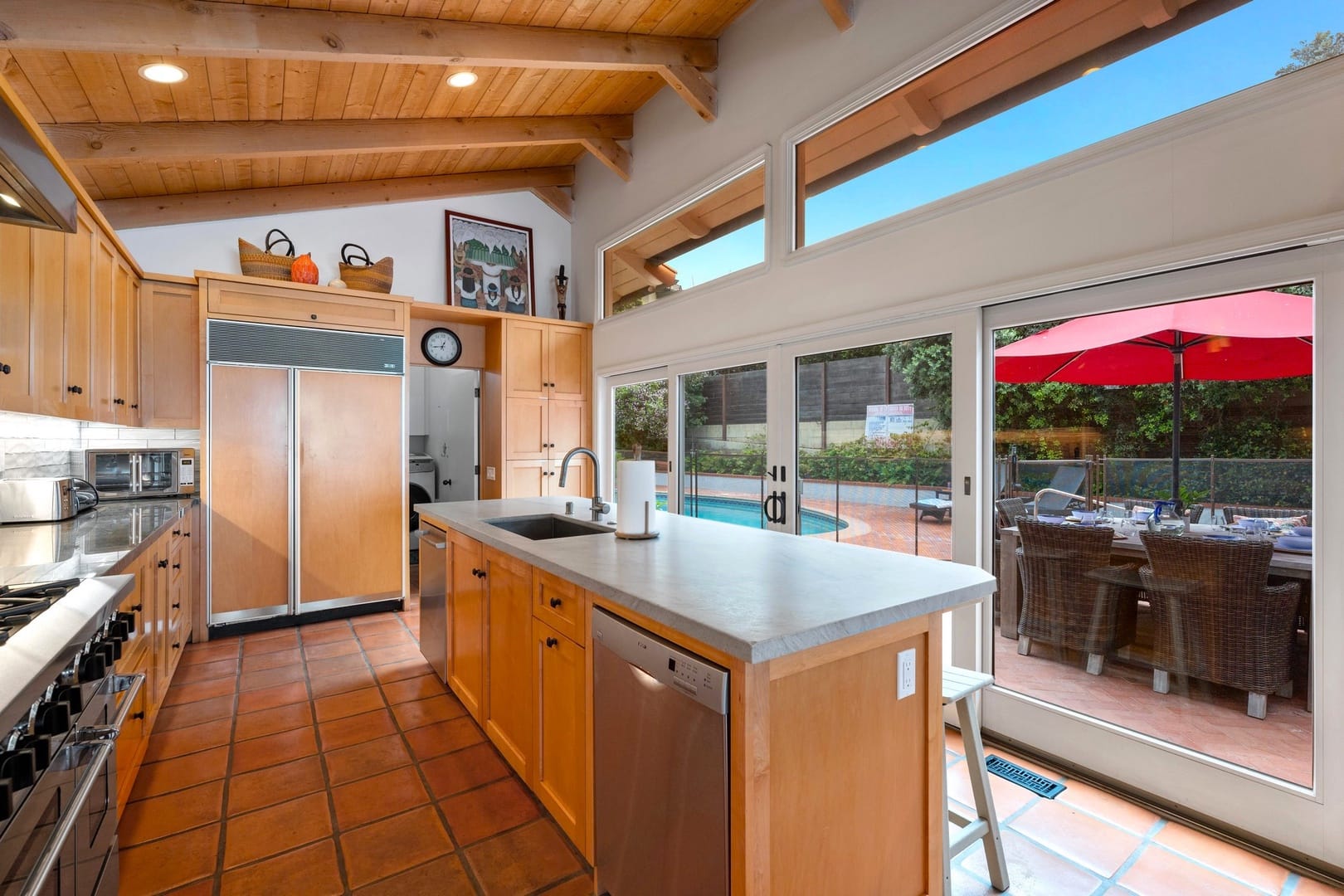 Modern kitchen with backyard view.