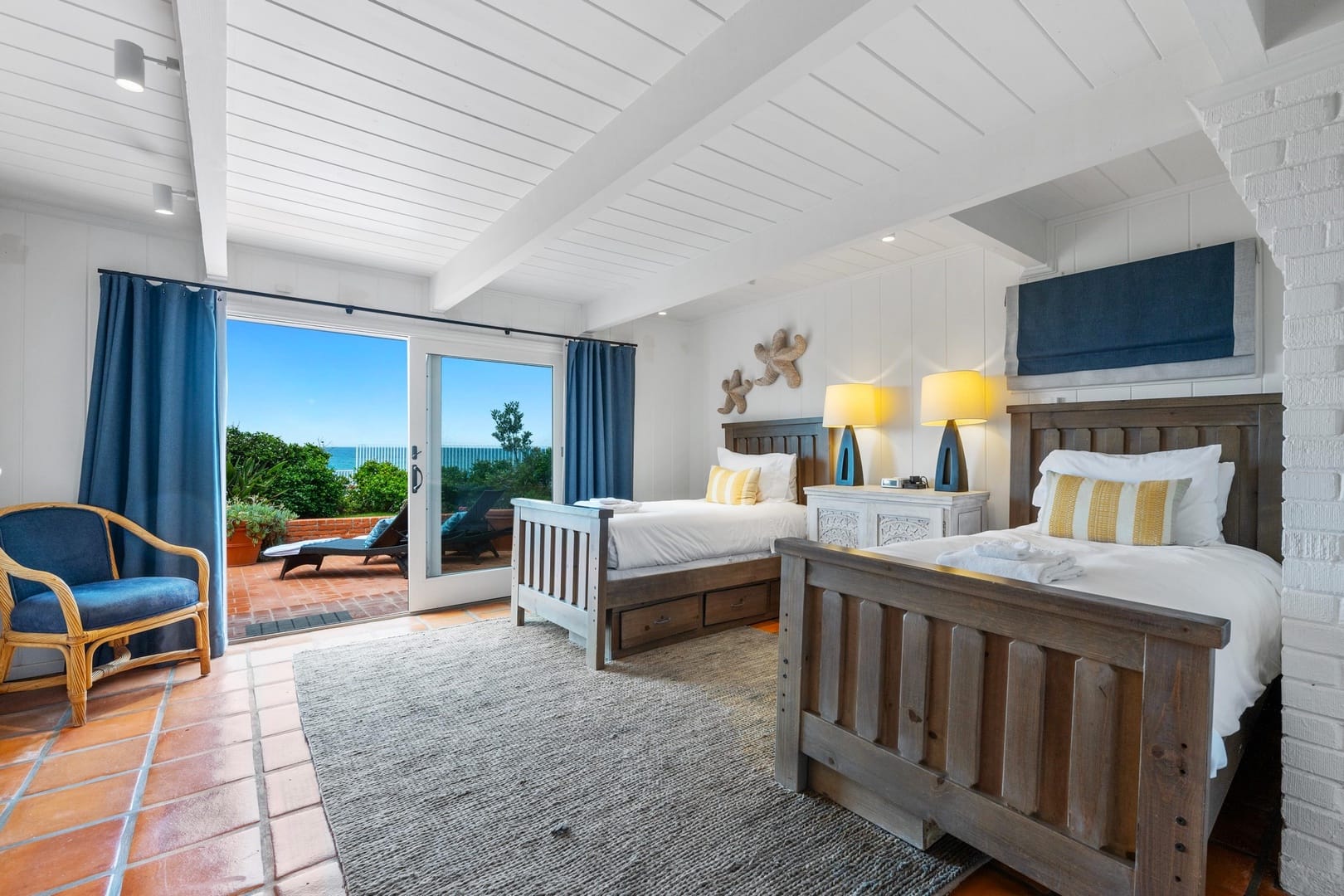 Two-bed room with patio view.