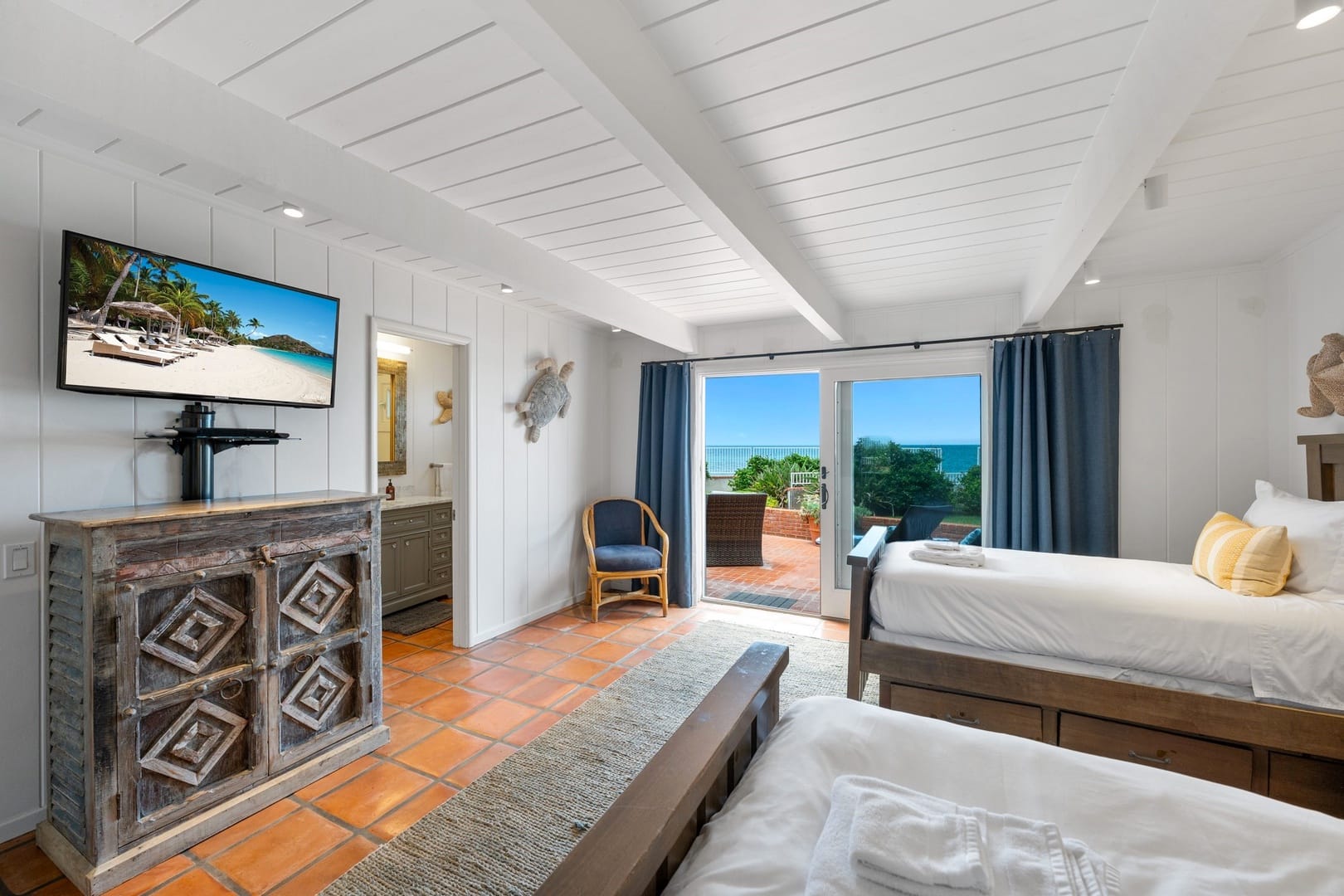 Airy bedroom with beach view.