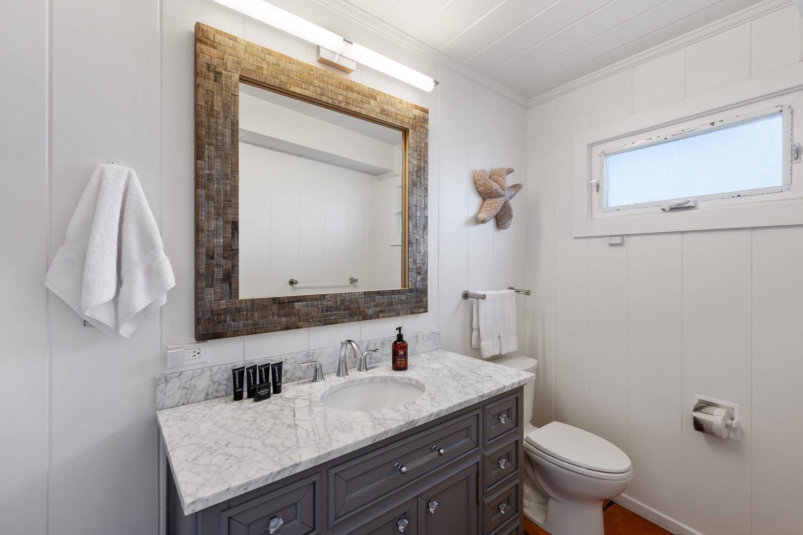 Modern bathroom with marble countertop.