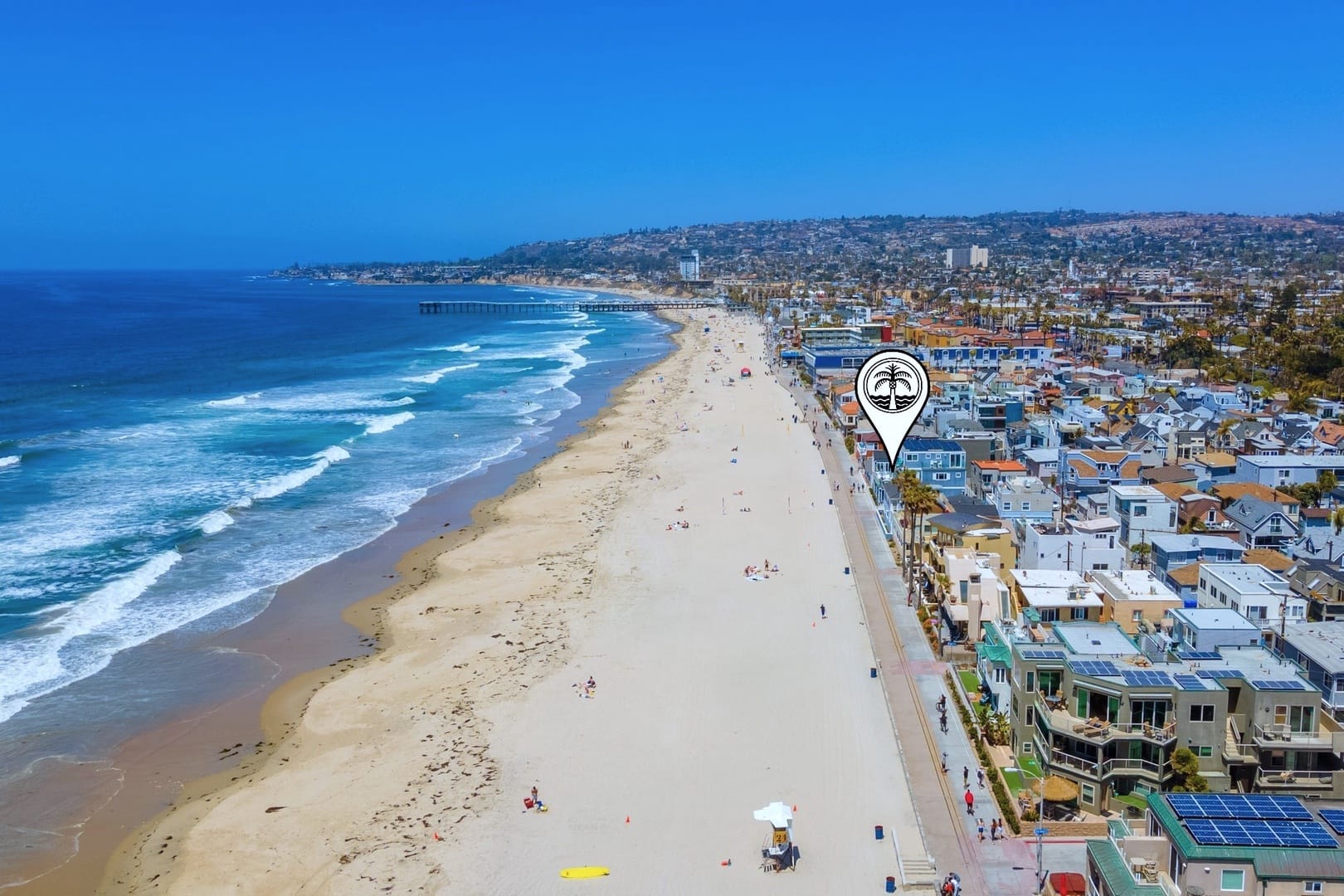 Aerial view of beach and buildings.