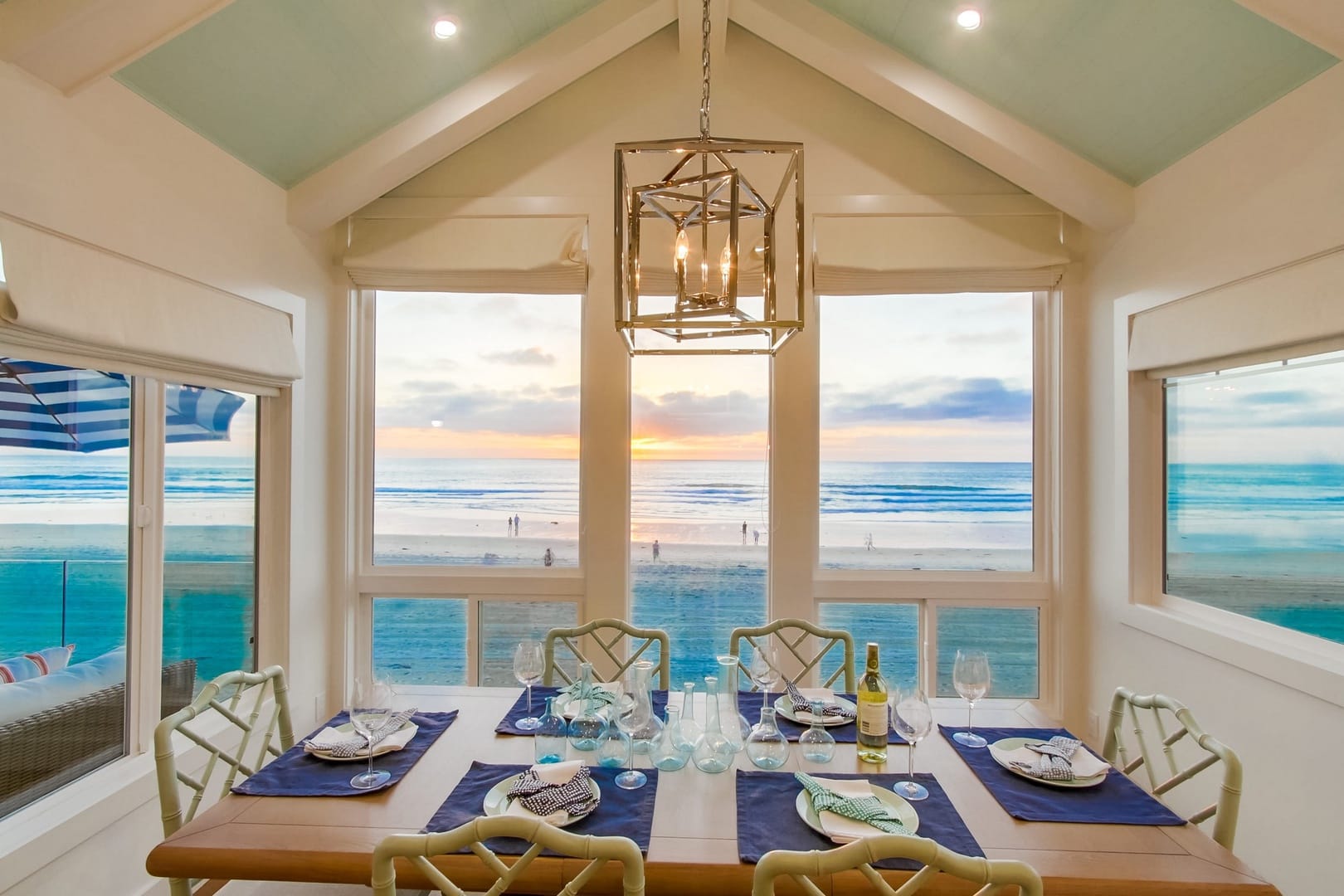 Dining room overlooking beach at sunset.