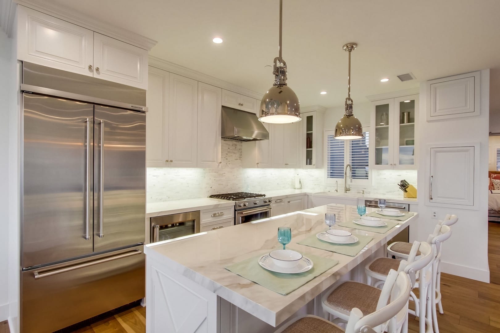 Modern kitchen with white cabinetry.