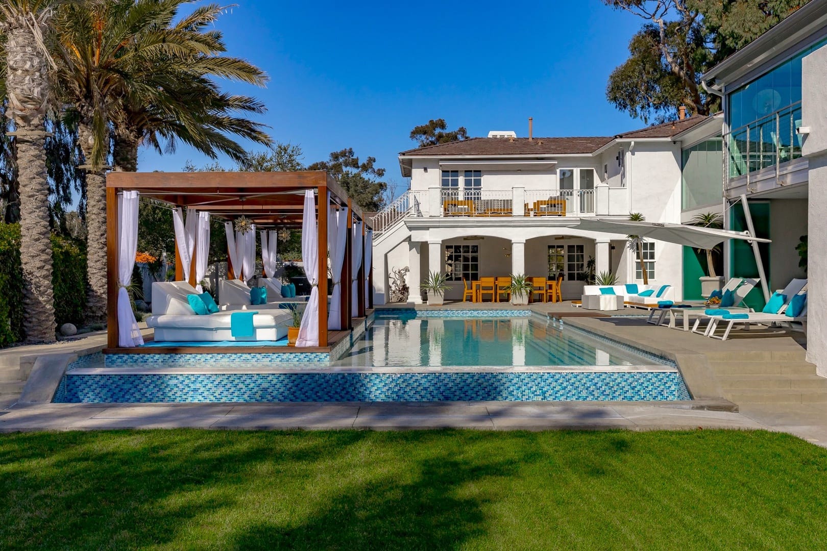 Luxurious backyard with pool cabana.