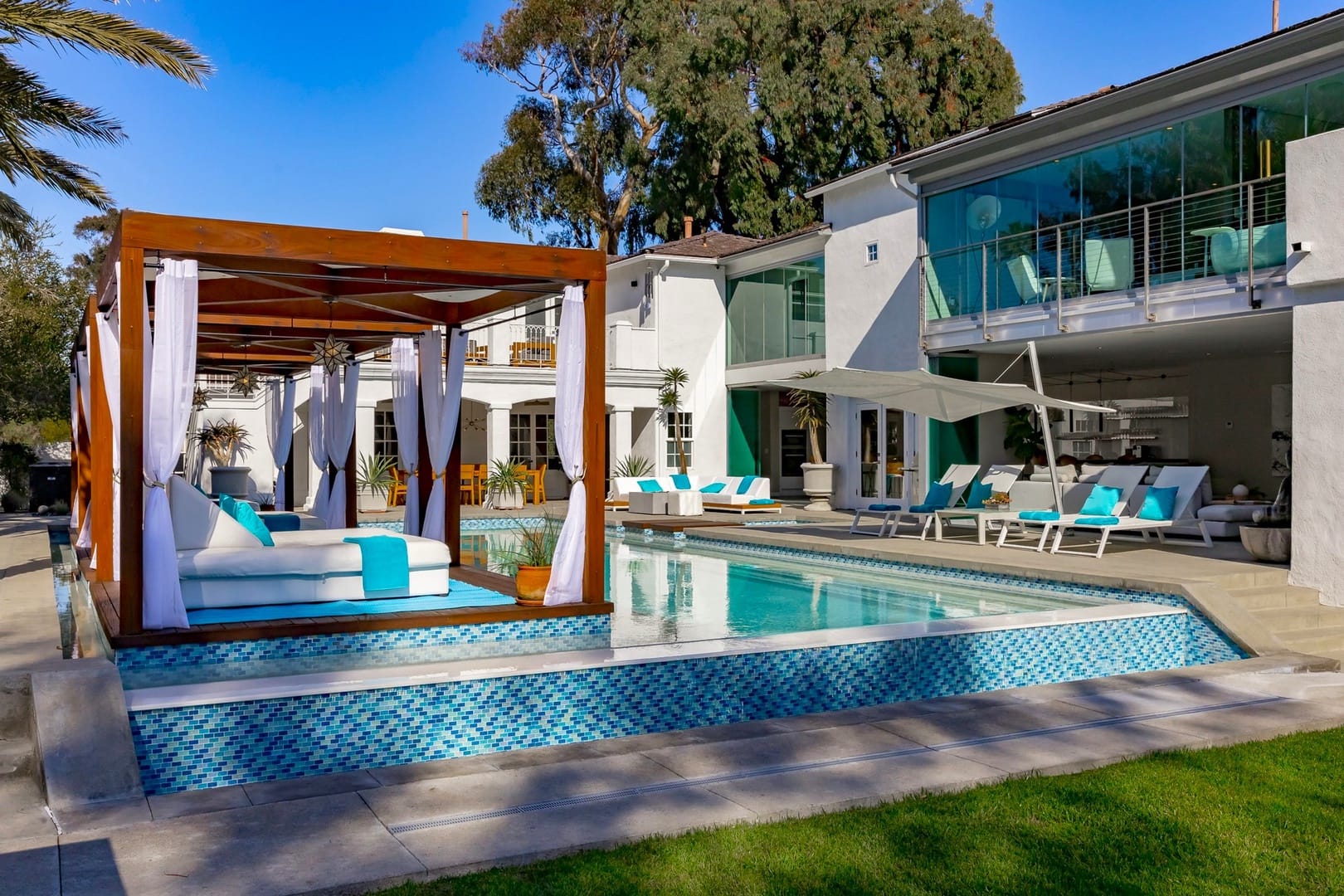 Luxurious poolside cabana and house