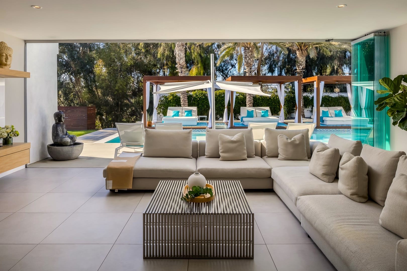 Modern living room with pool view.