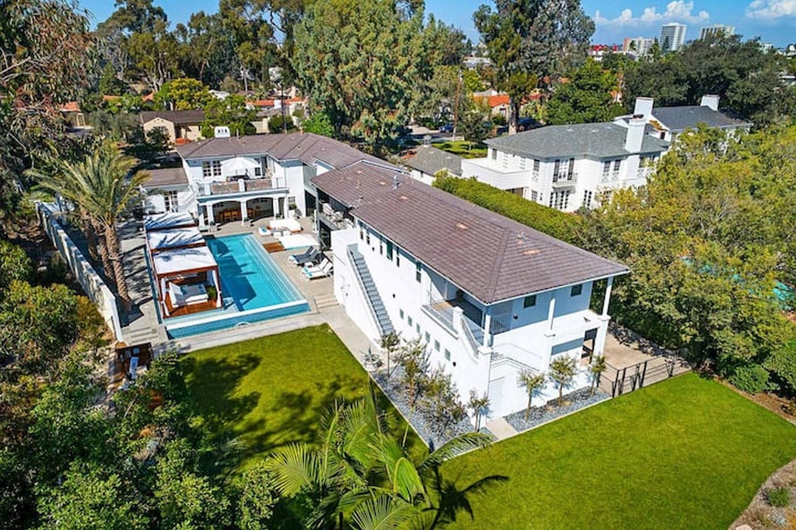 Luxurious house with pool aerial view.