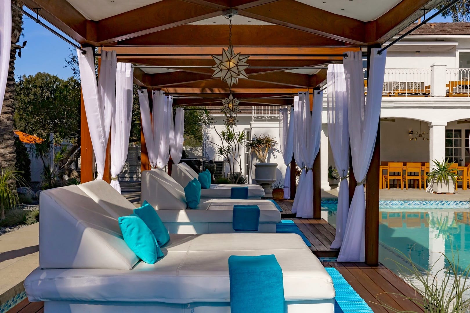 Poolside cabana with lounge chairs.