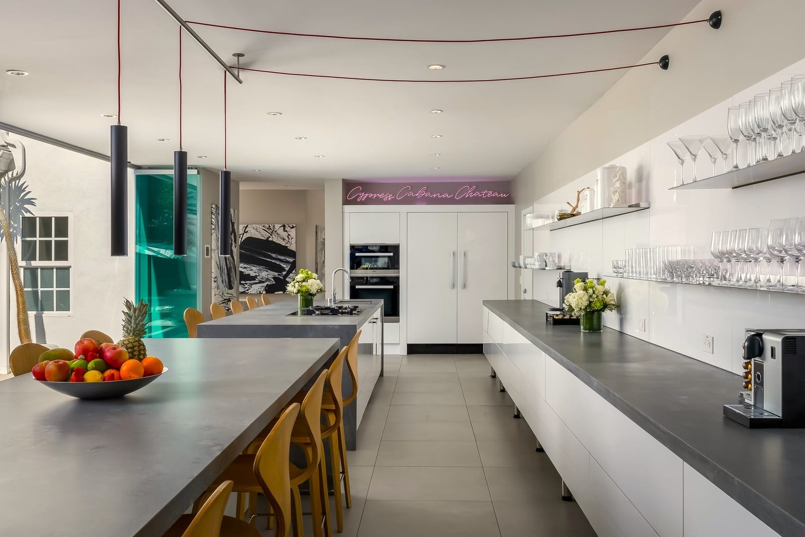 Modern kitchen with grey countertops.